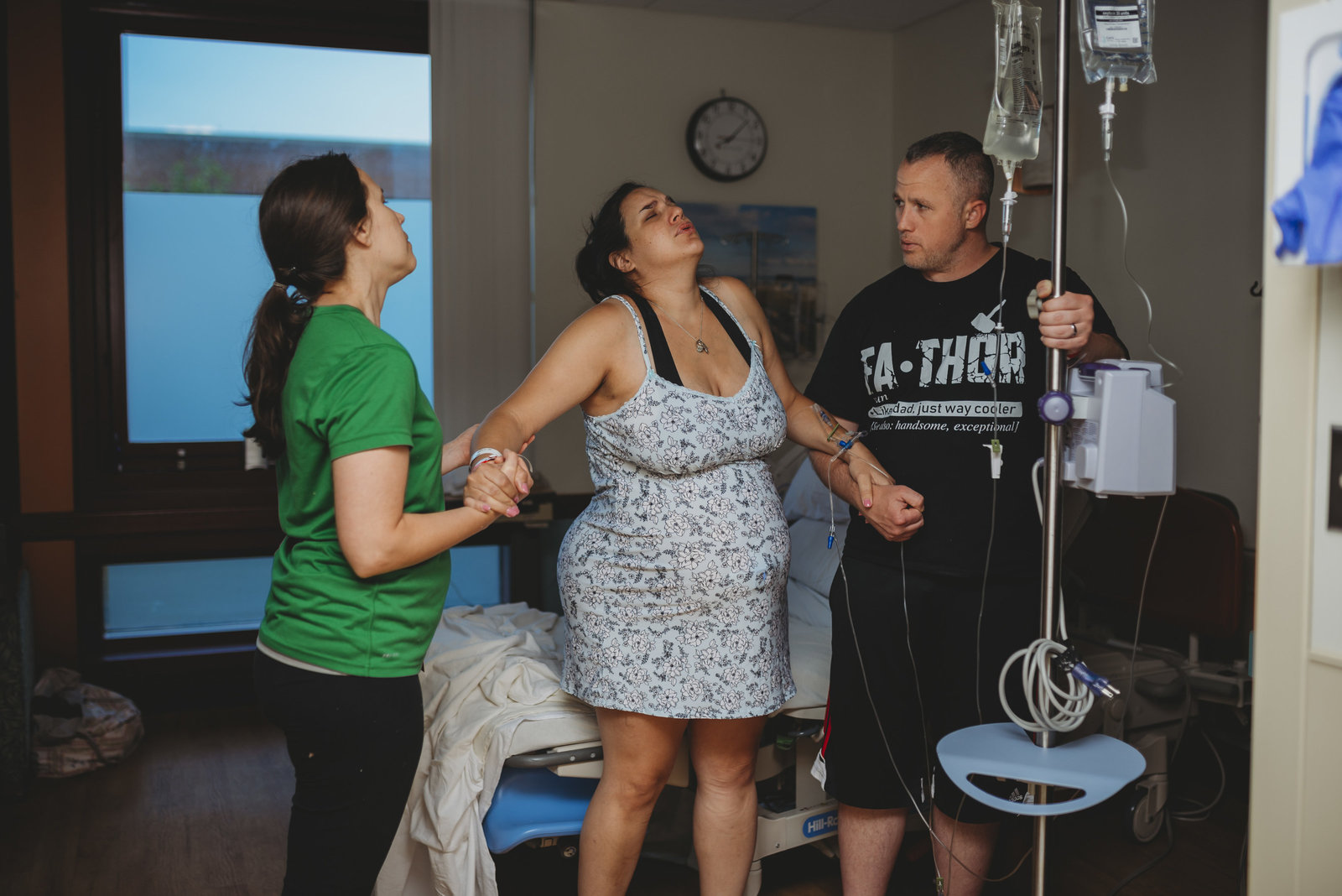 dad and doula support mom during hospital birth in Tampa