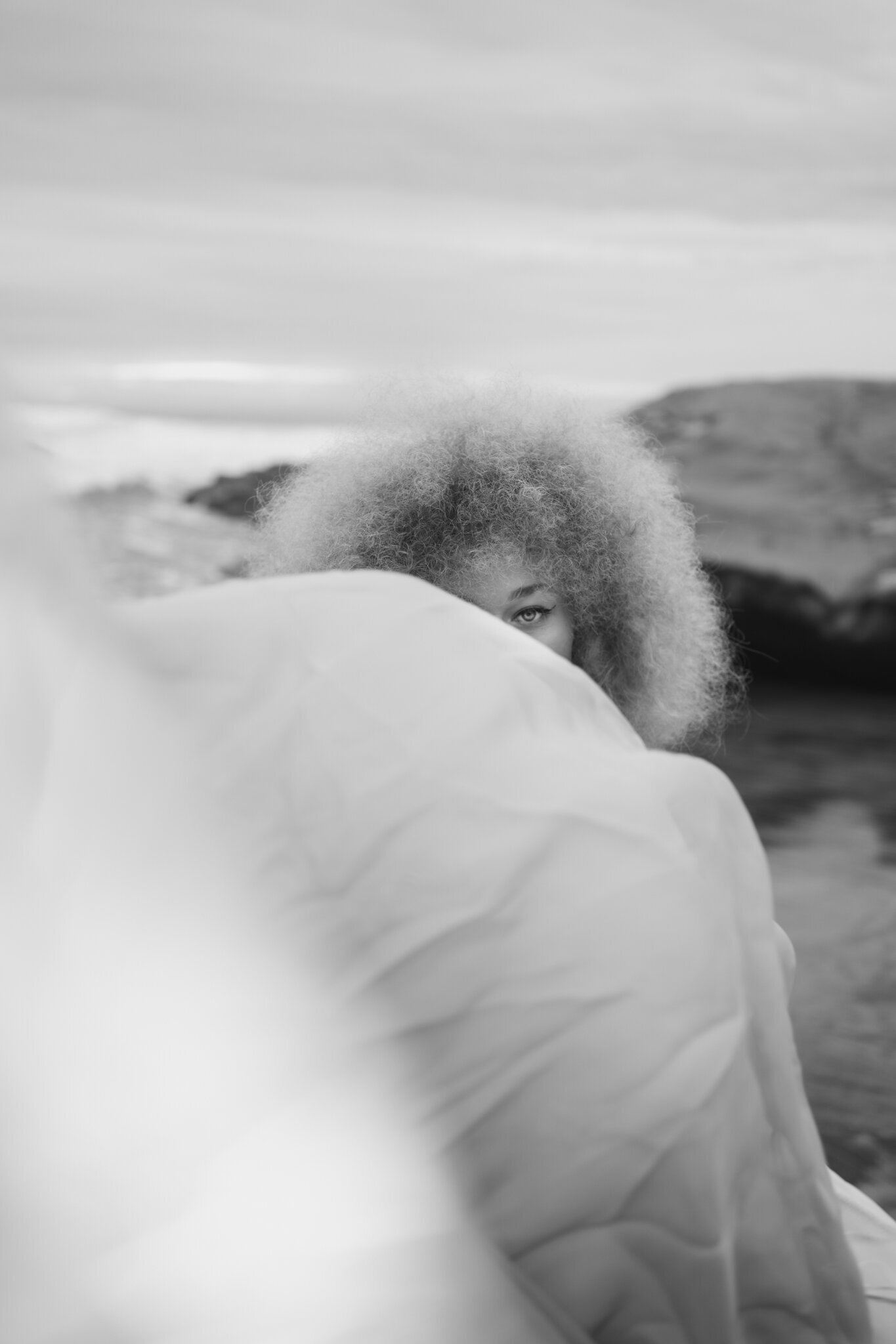 Headshot of woman eye taken while dancing at the beach