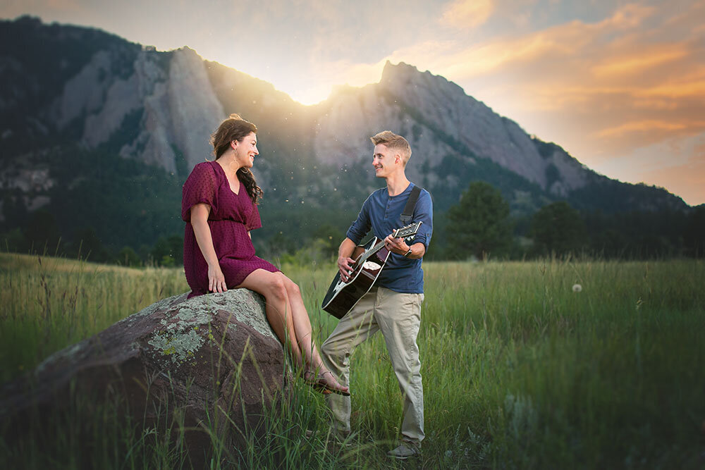 sernade-music-lovers-couple-rock-playing-guitar-wife-husband-romantic-mountain-backdrop-sunset-boulder-ncar-flatirons-jewel-tone