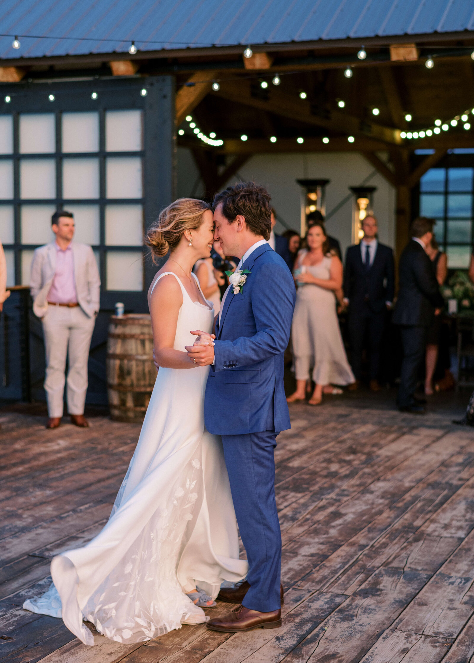 An emotional first dance is shared outdoors by the bride and groom, photograph captured by Virginia wedding photographer