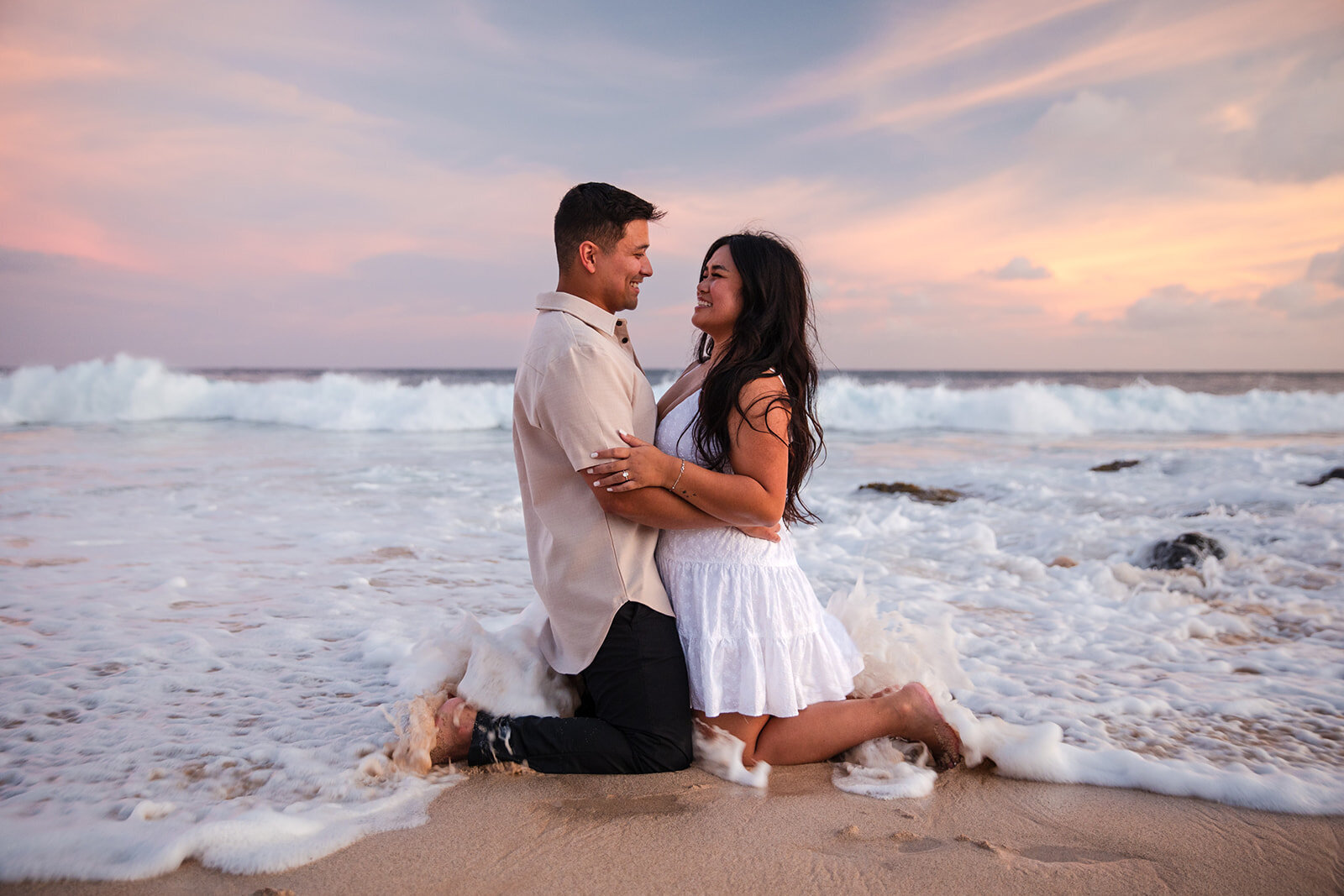 Couple holding each other on Poipu Beach
