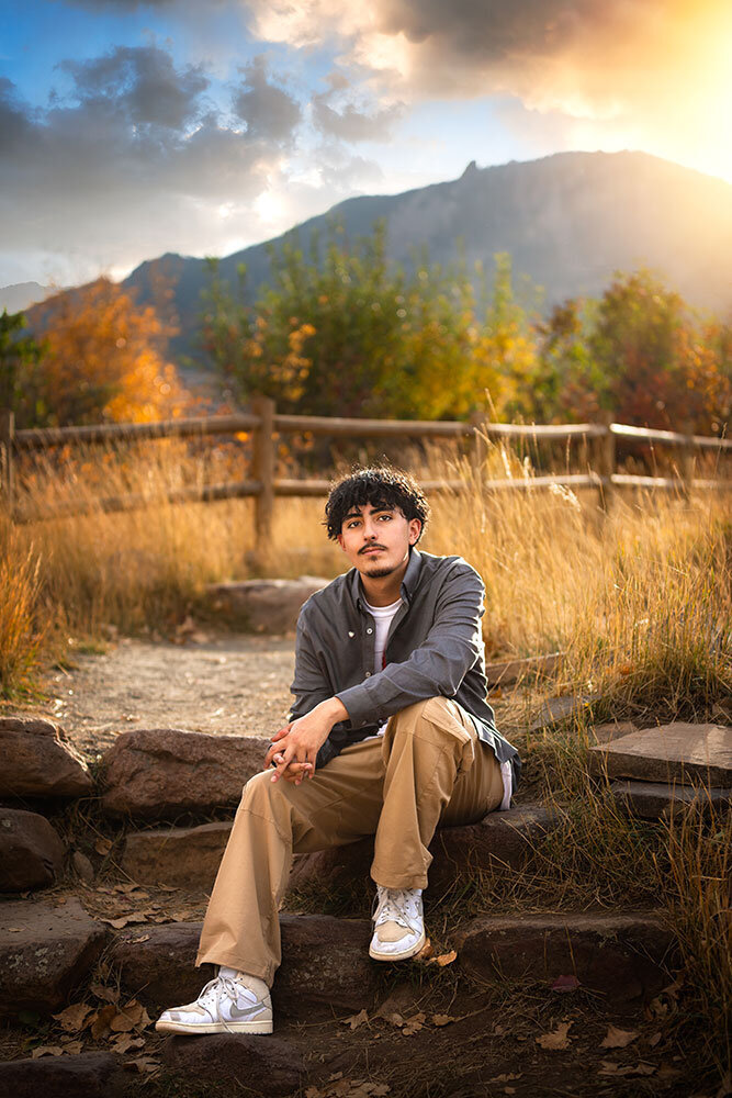 mountain-fence-backlight-sun-senior-boy-high-school-holy-family