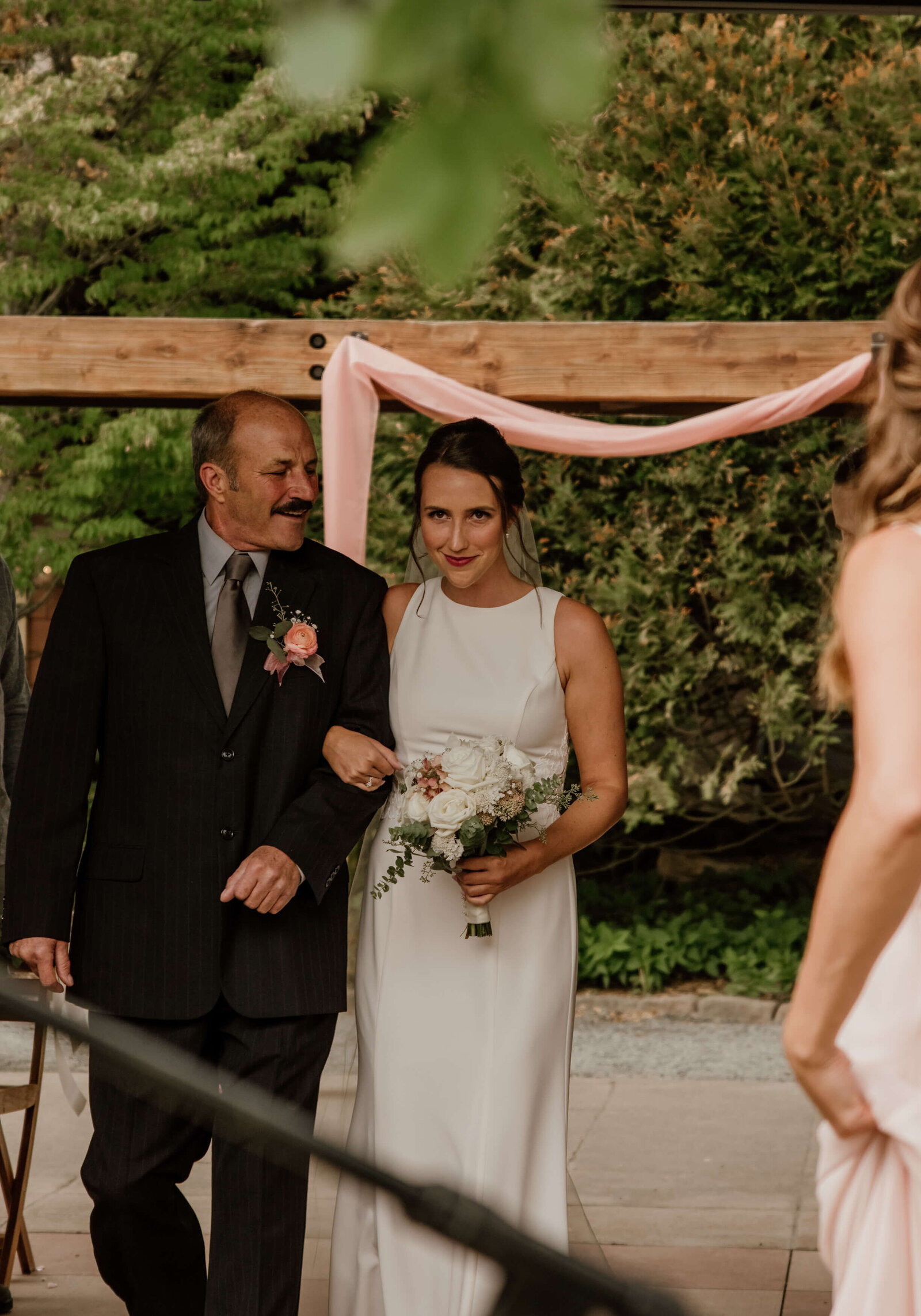 Bride's father walks her down the aisle.