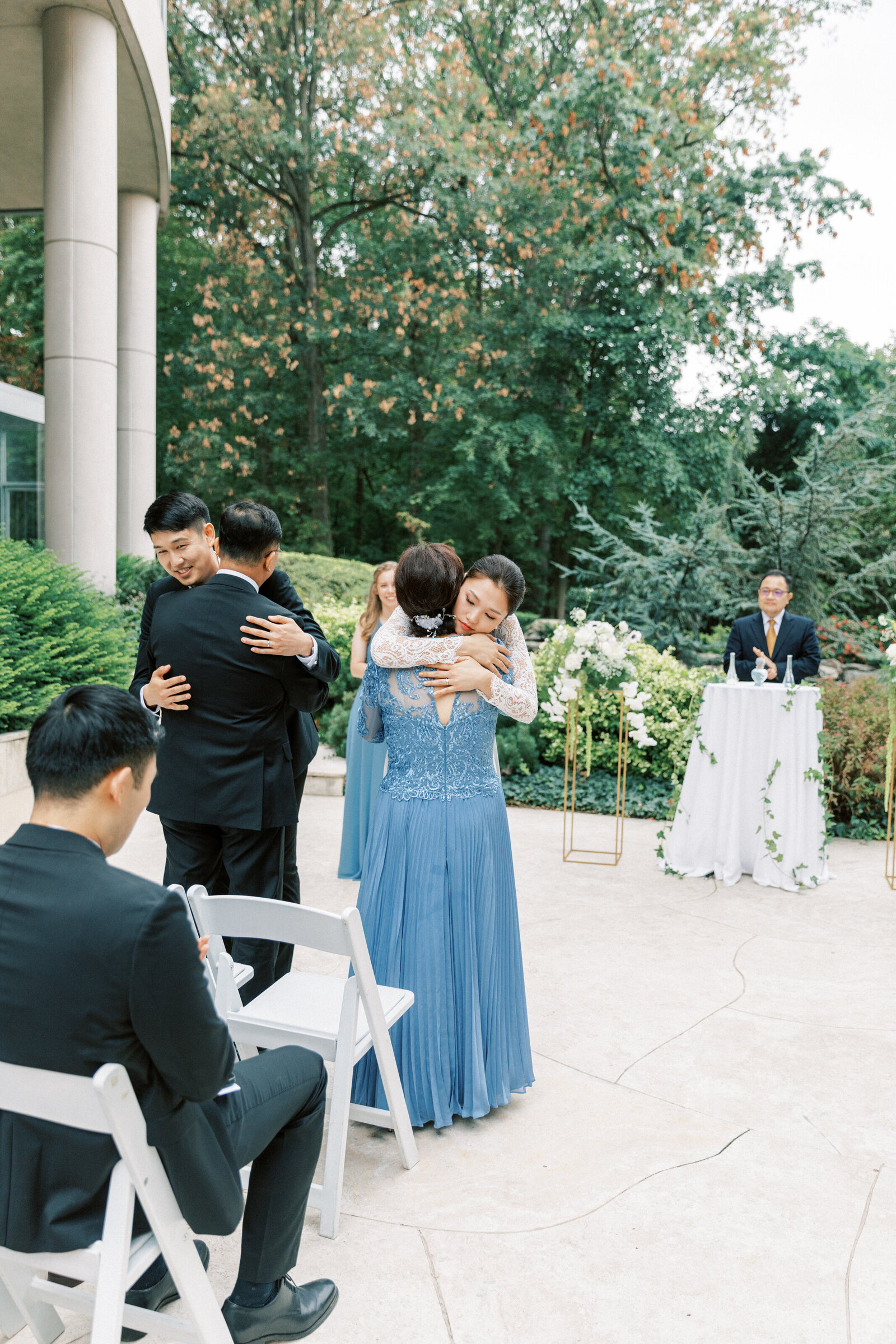 Couple hugs their parents before the ceremony starts