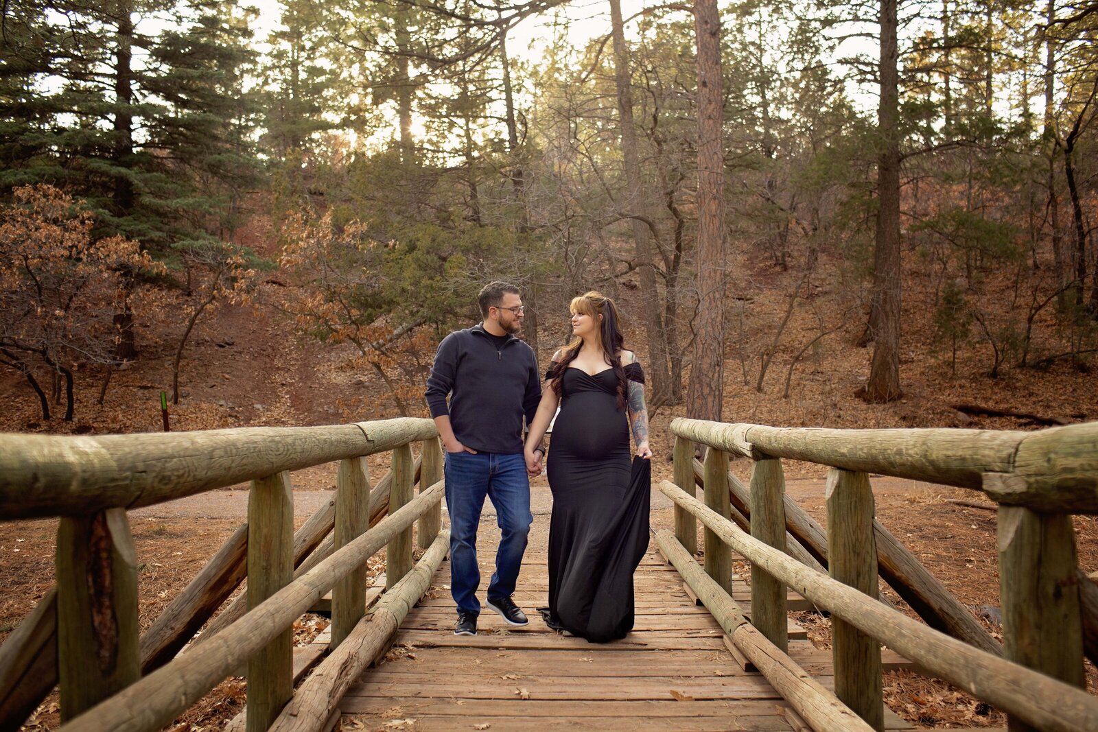 NM-maternity-session-couple-walking-on-a-bridge-in-the-mountains