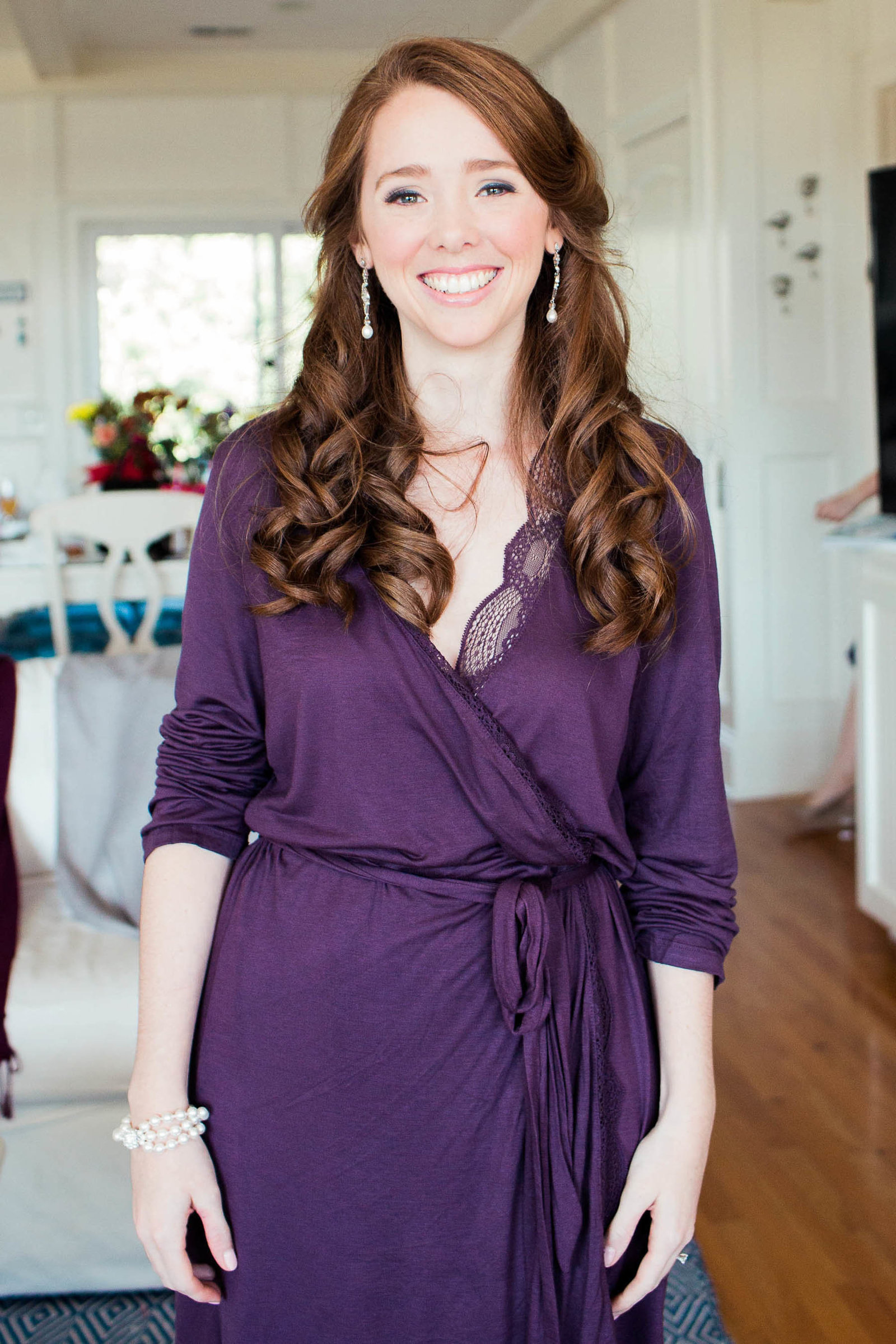 Bride smiles in purple robe, Isle of Palms, Charleston, South Carolina