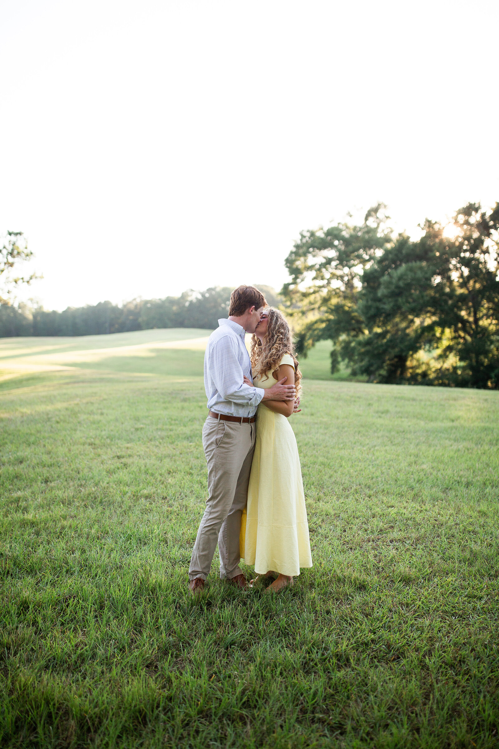 Natural light engagement photographer Alabama outdoor romantic session candid.