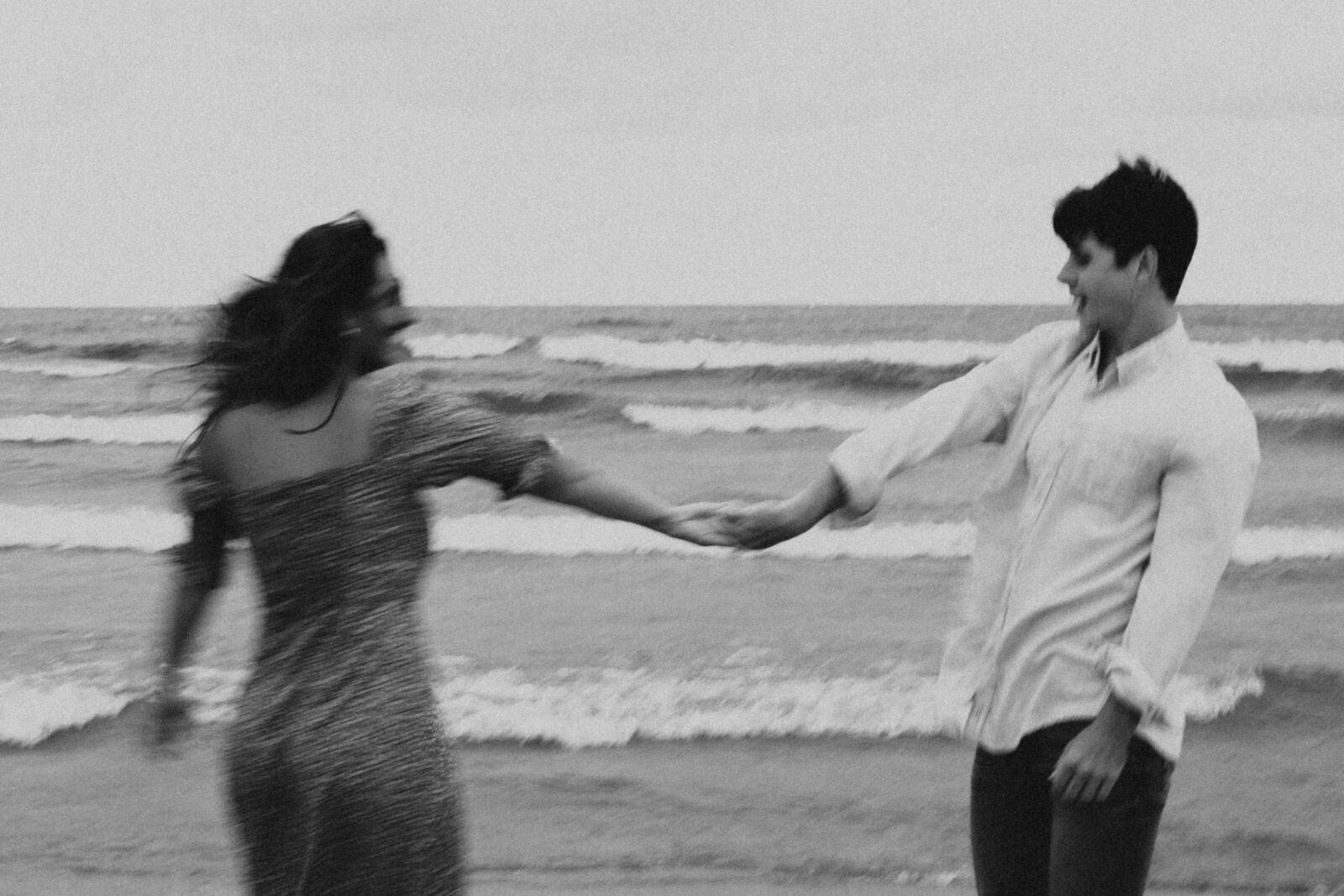 Blurry photo of a couple holding hands at Silver Beach