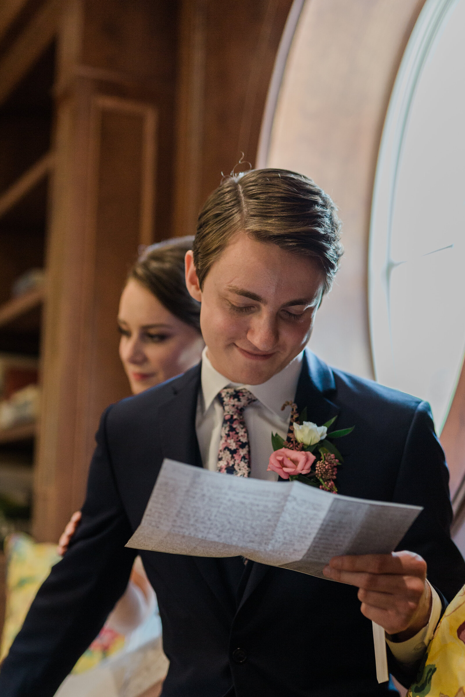 Groom reads his bride's letter before ceremony