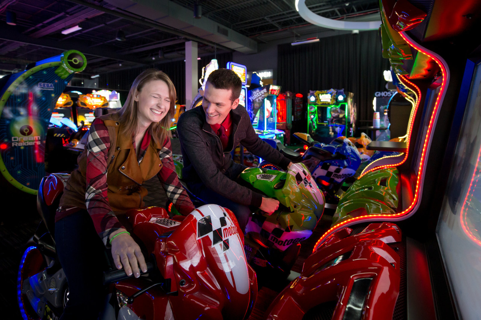 fun engagement shoot at dave and busters rochester new york