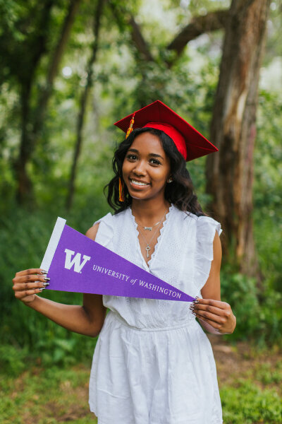 Senior portrait photographer pricing session with cap and gown