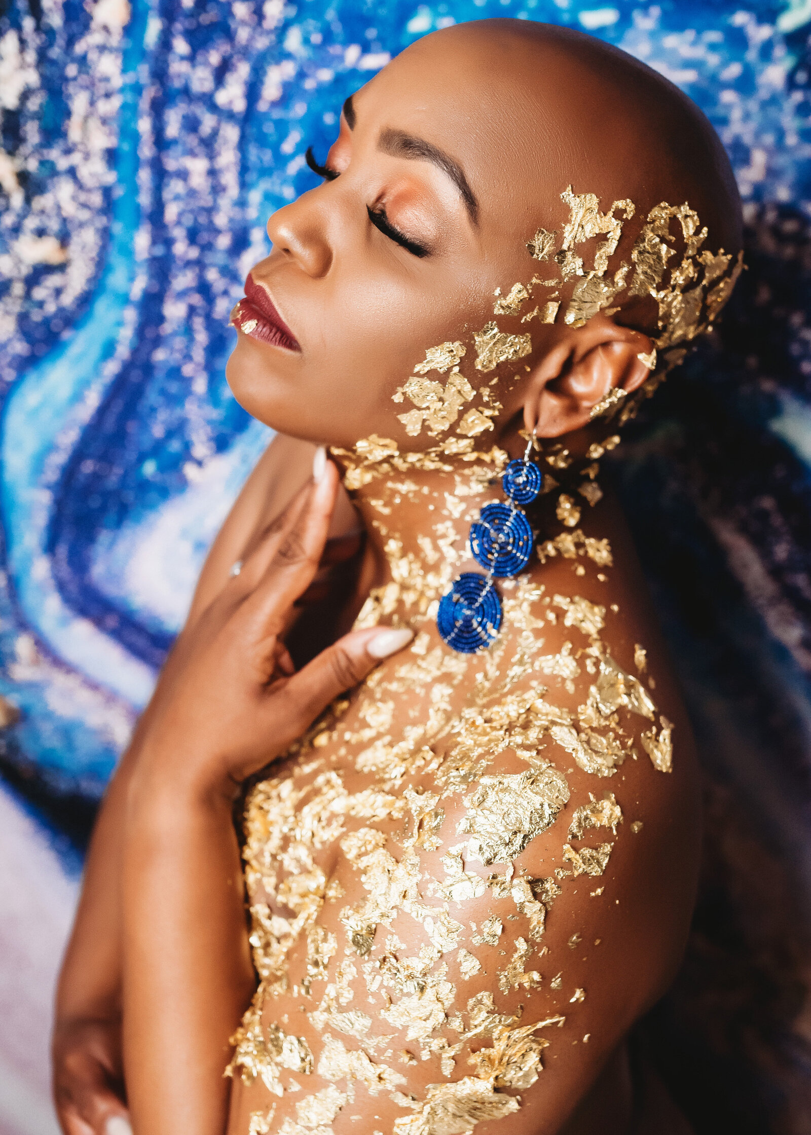 black woman with gold philly portraits