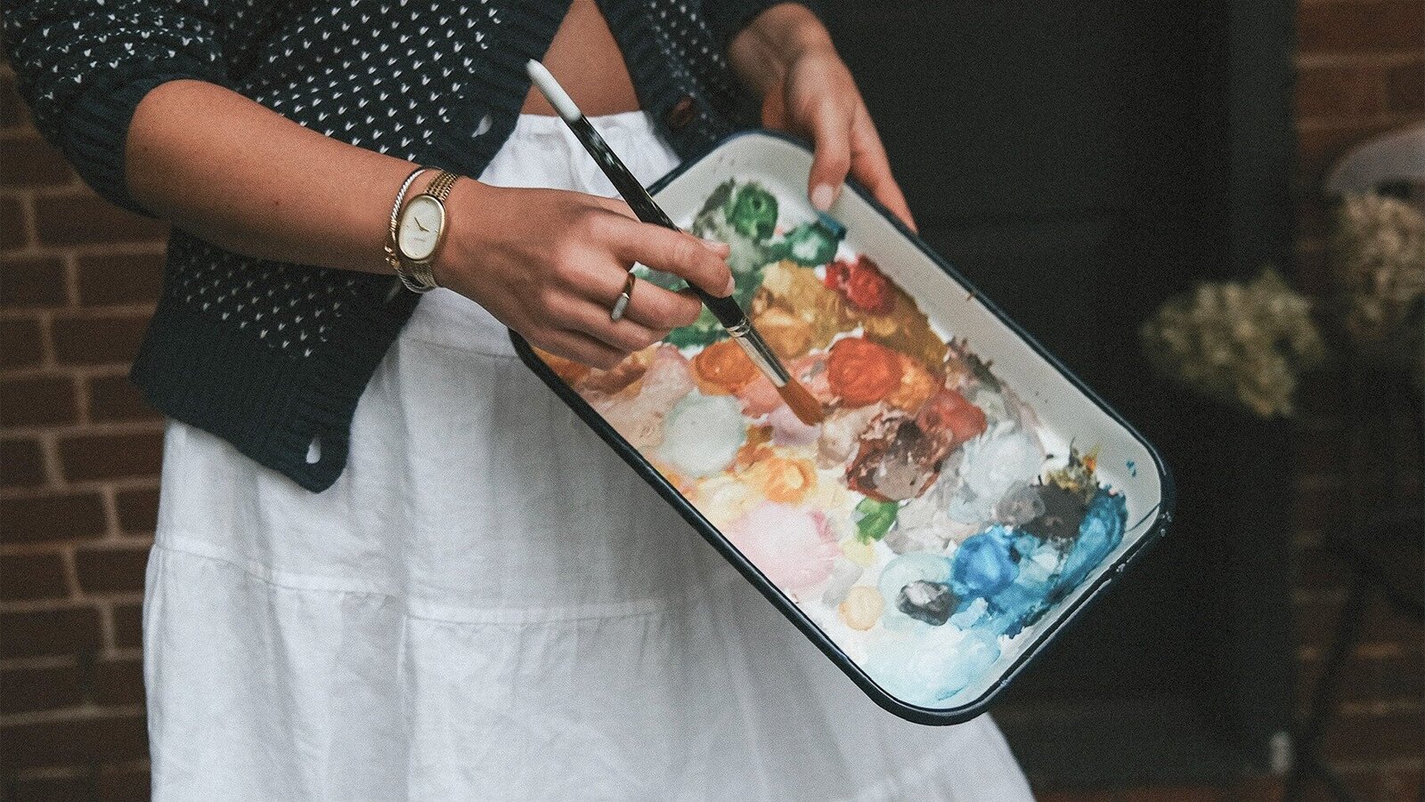 Image of artist of hand-painted wedding invitations