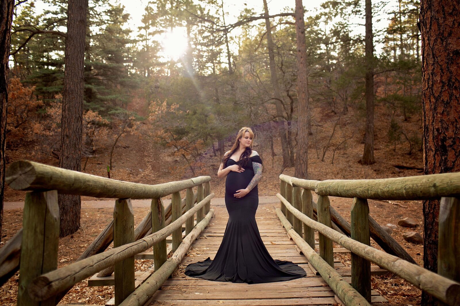 New-Mexico-Maternity-session-black-dress-on-a-bridge