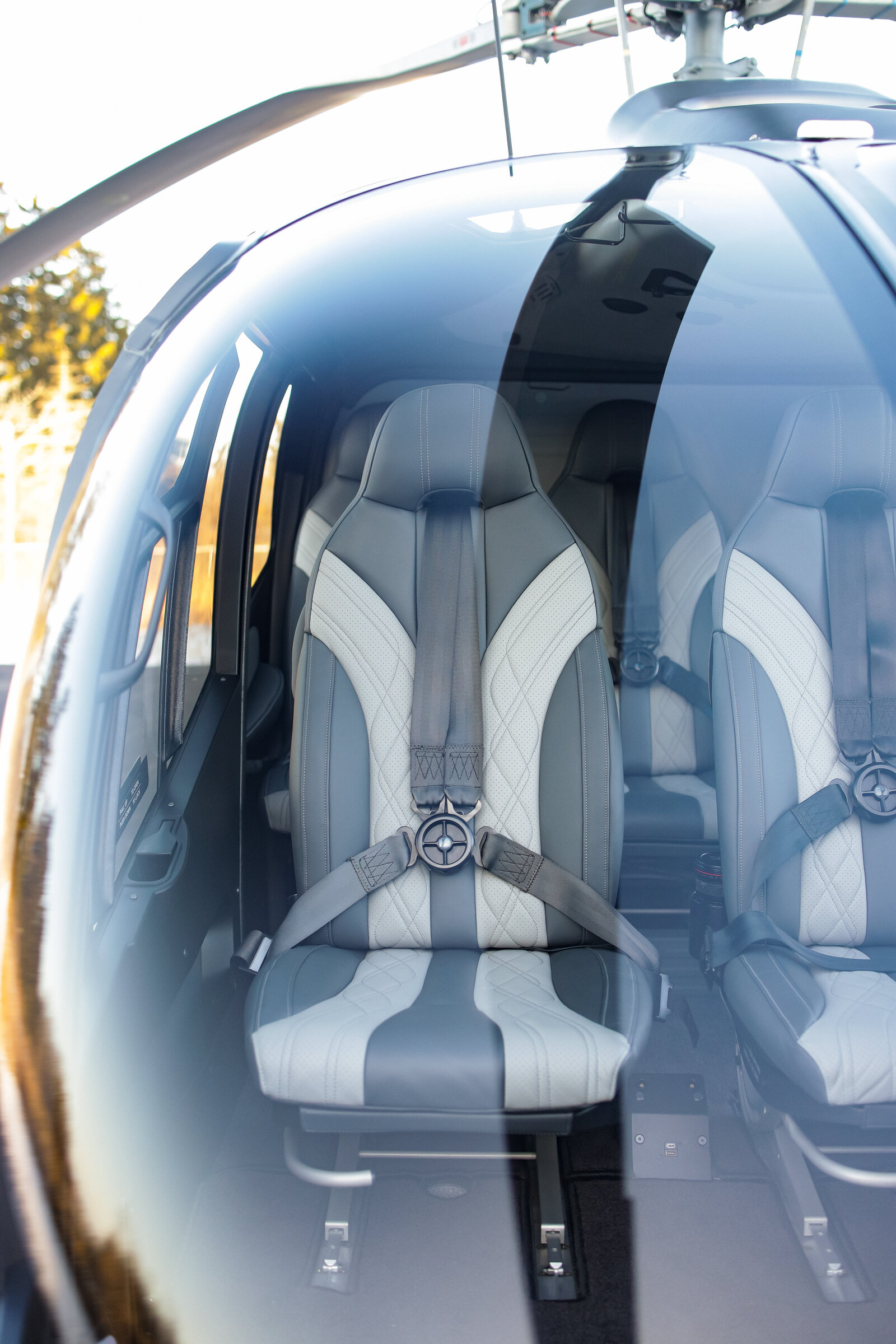 blue airbus ec130 b4 helicopter interior grey seats -