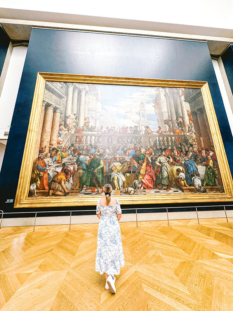 girl in front of museum painting