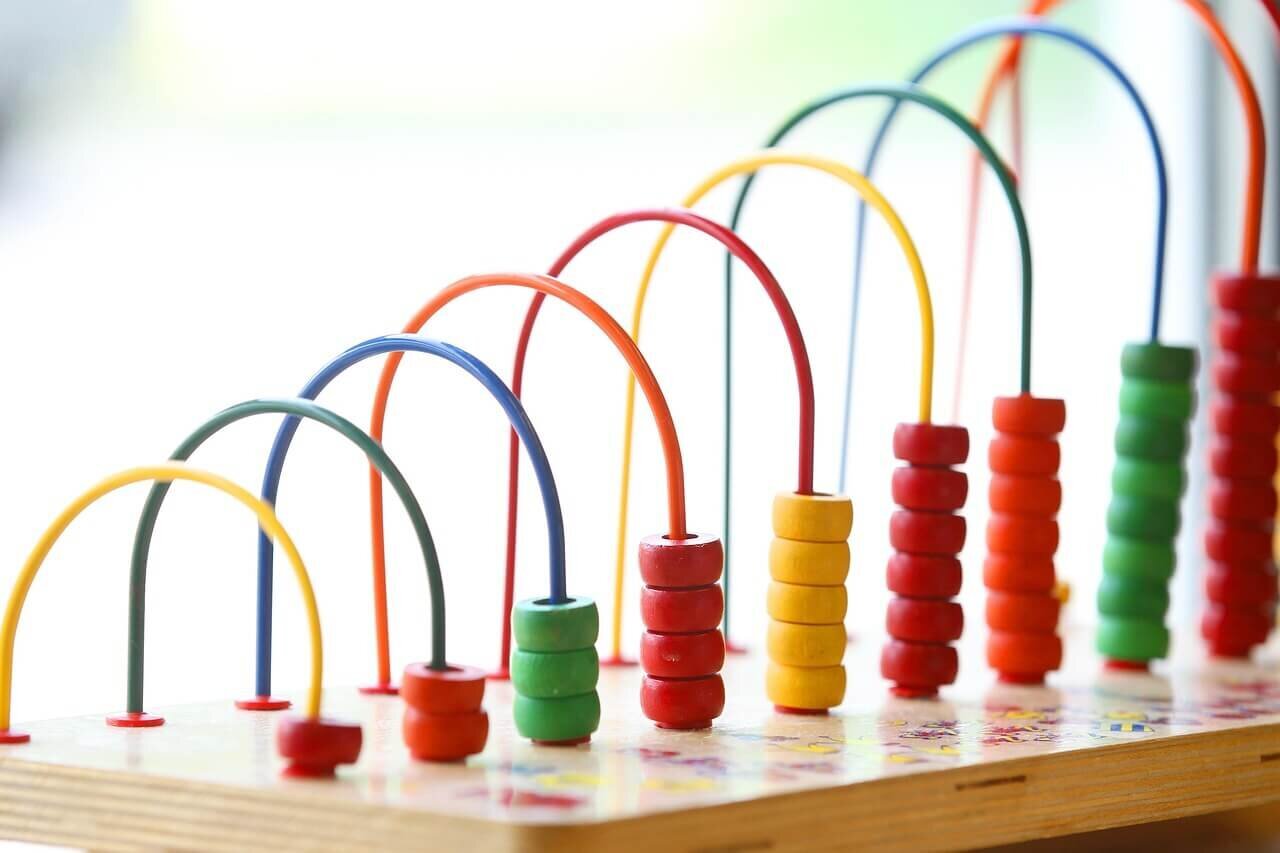 baby playing with stacking toys
