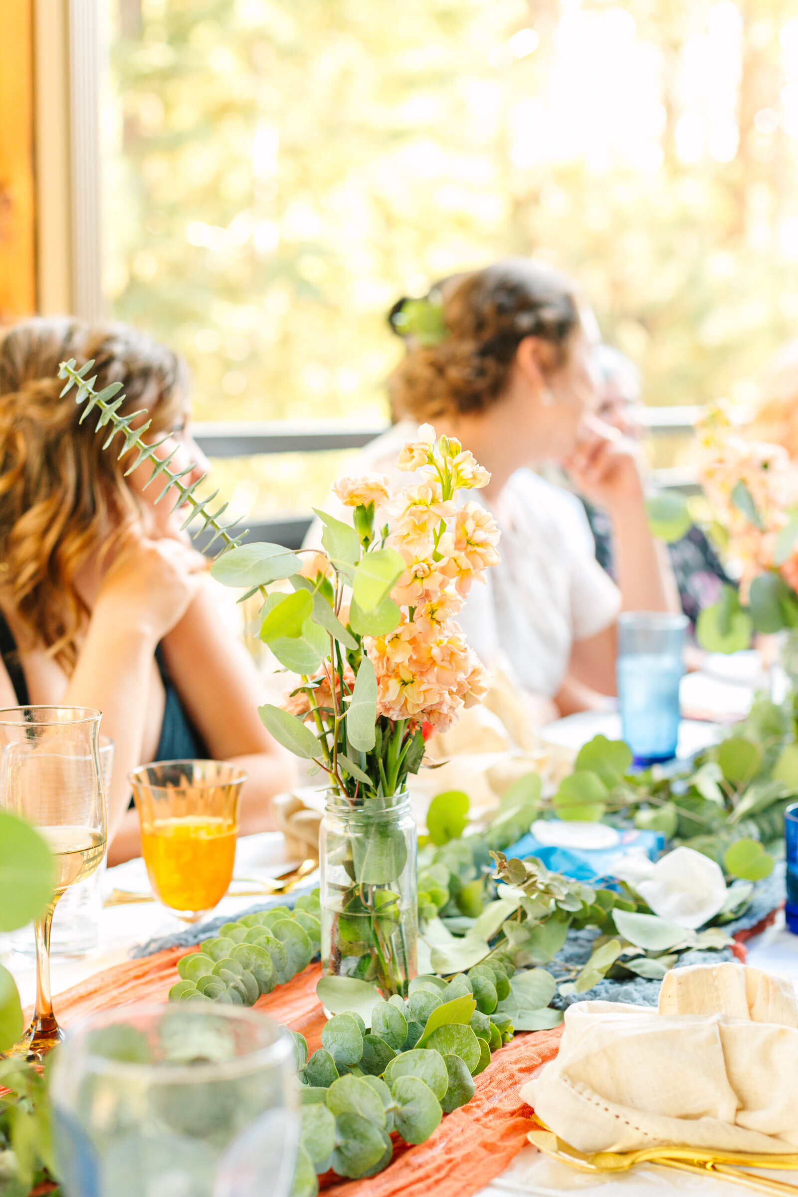 Colorful and boho details at an intimate elopement at a cabin at Big Bear Lake, California.