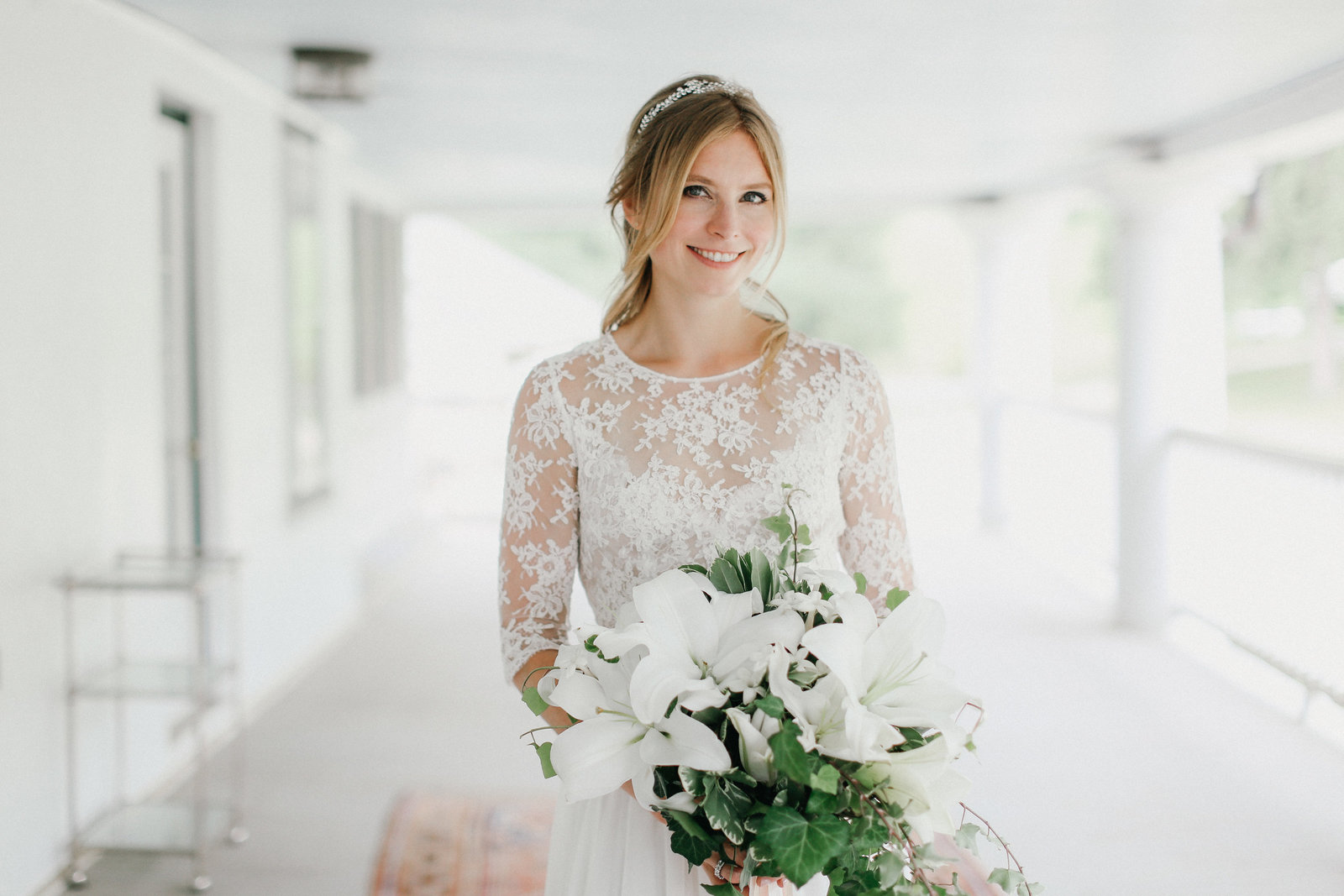 Beautiful bride wearing  her Margaux Tardits wedding gown and stunning Wild Stems white lily bouquet.