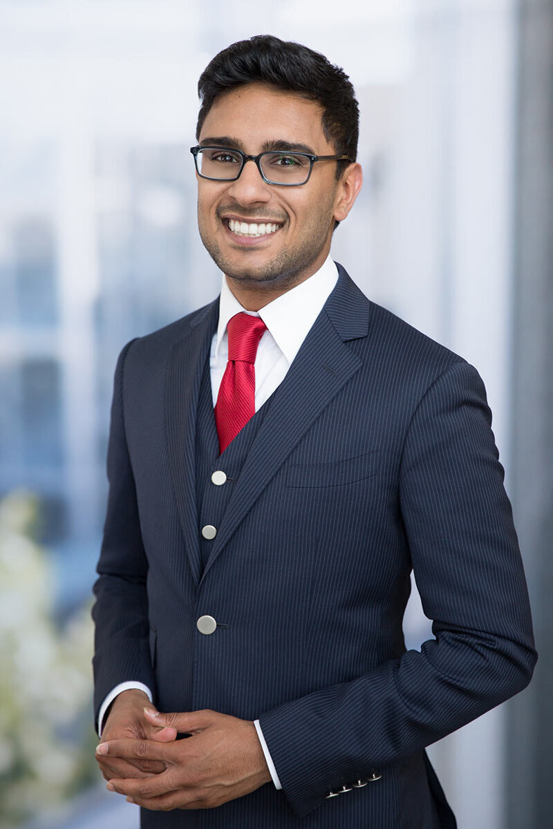 Corporate headshot of man in suit and red tie located in Austin TX