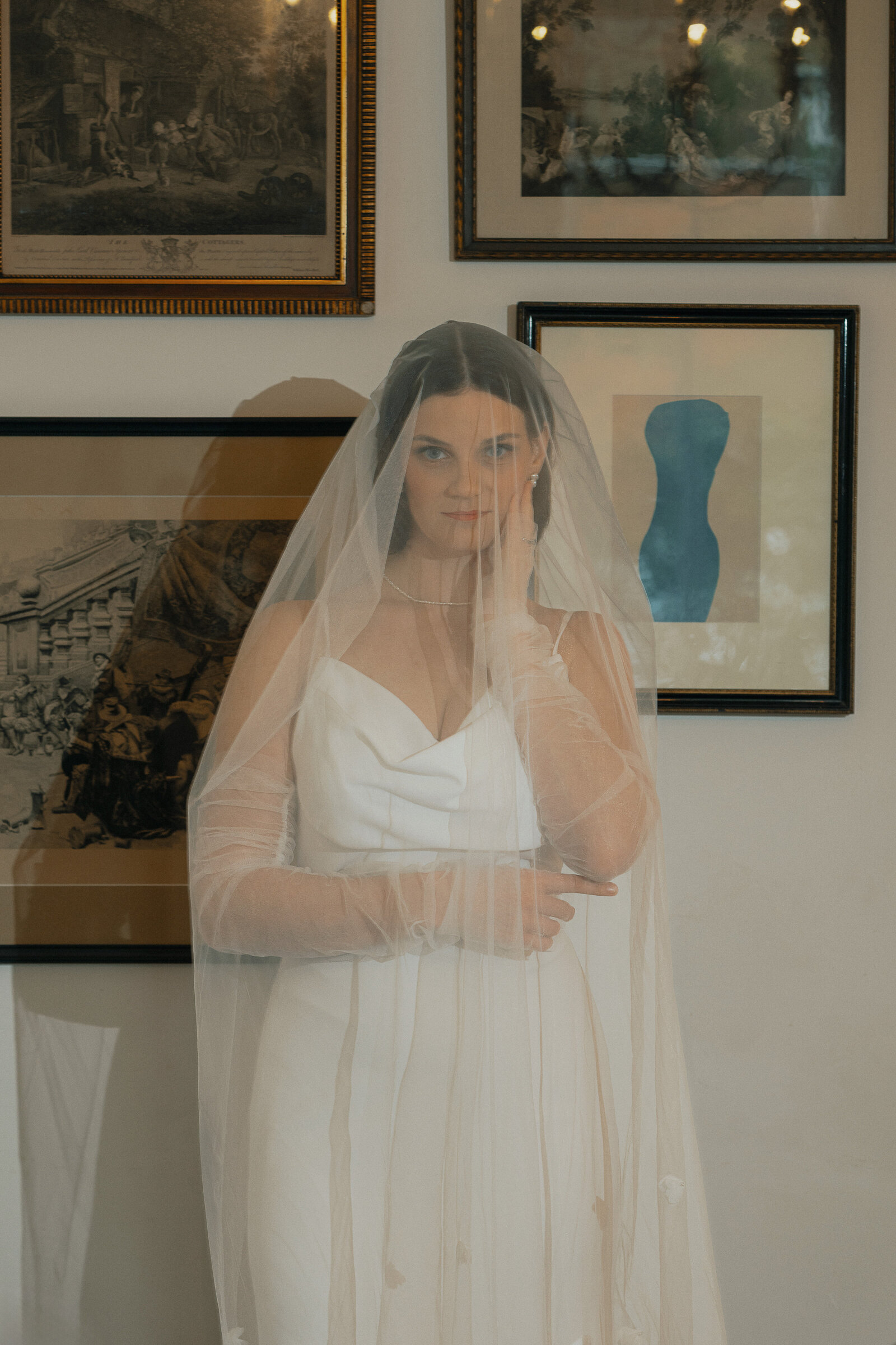 editorial off camera flash photo of bride under her veil at Cuckoo Trattoria and Pizza in Coombs during wedding portraits by Latitude 49 Photography