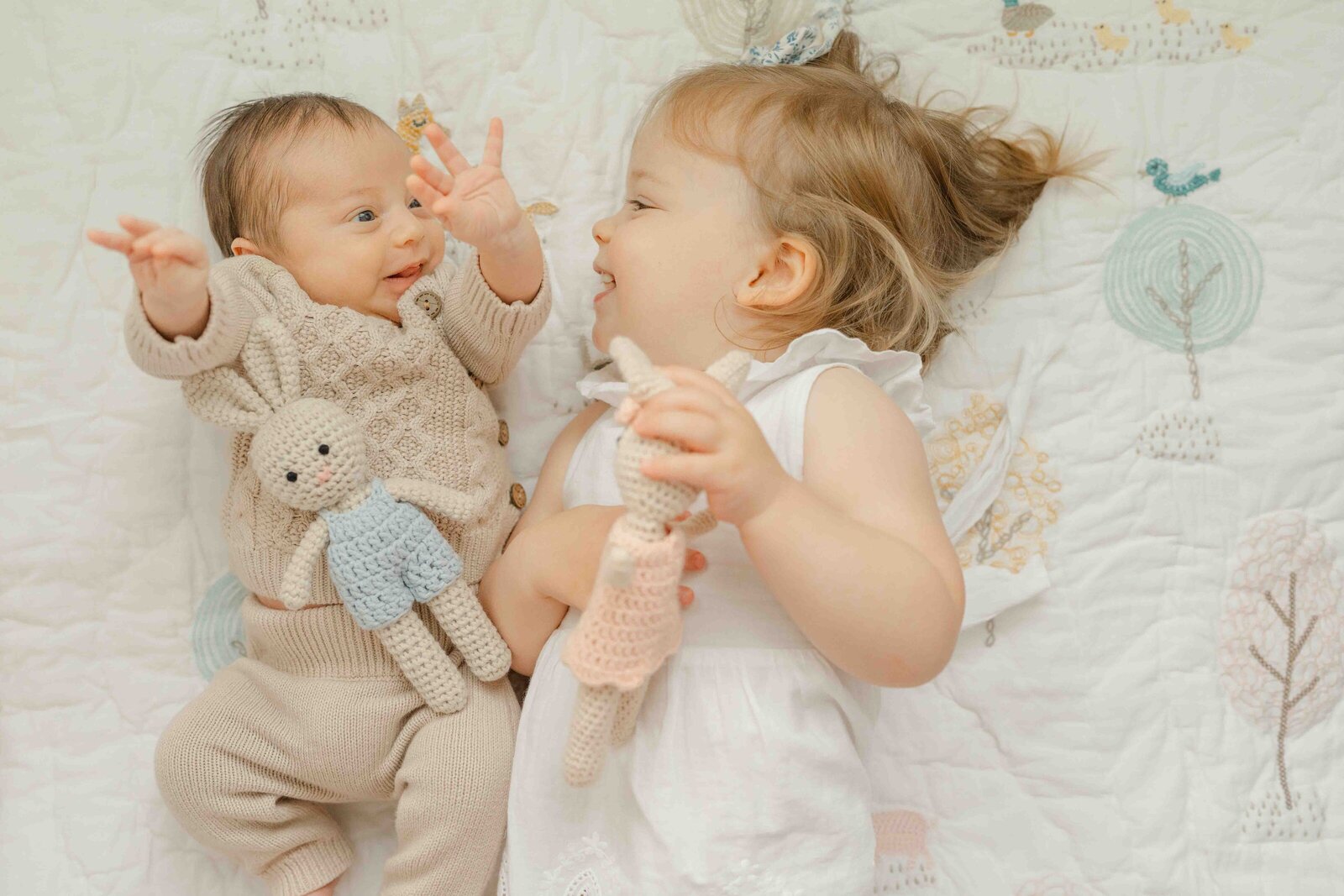 big sister playing with baby during Centreville, VA newborn picture