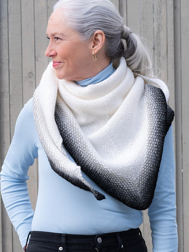 Natural makeup for a m odel with grey hair wearing a white scarf
