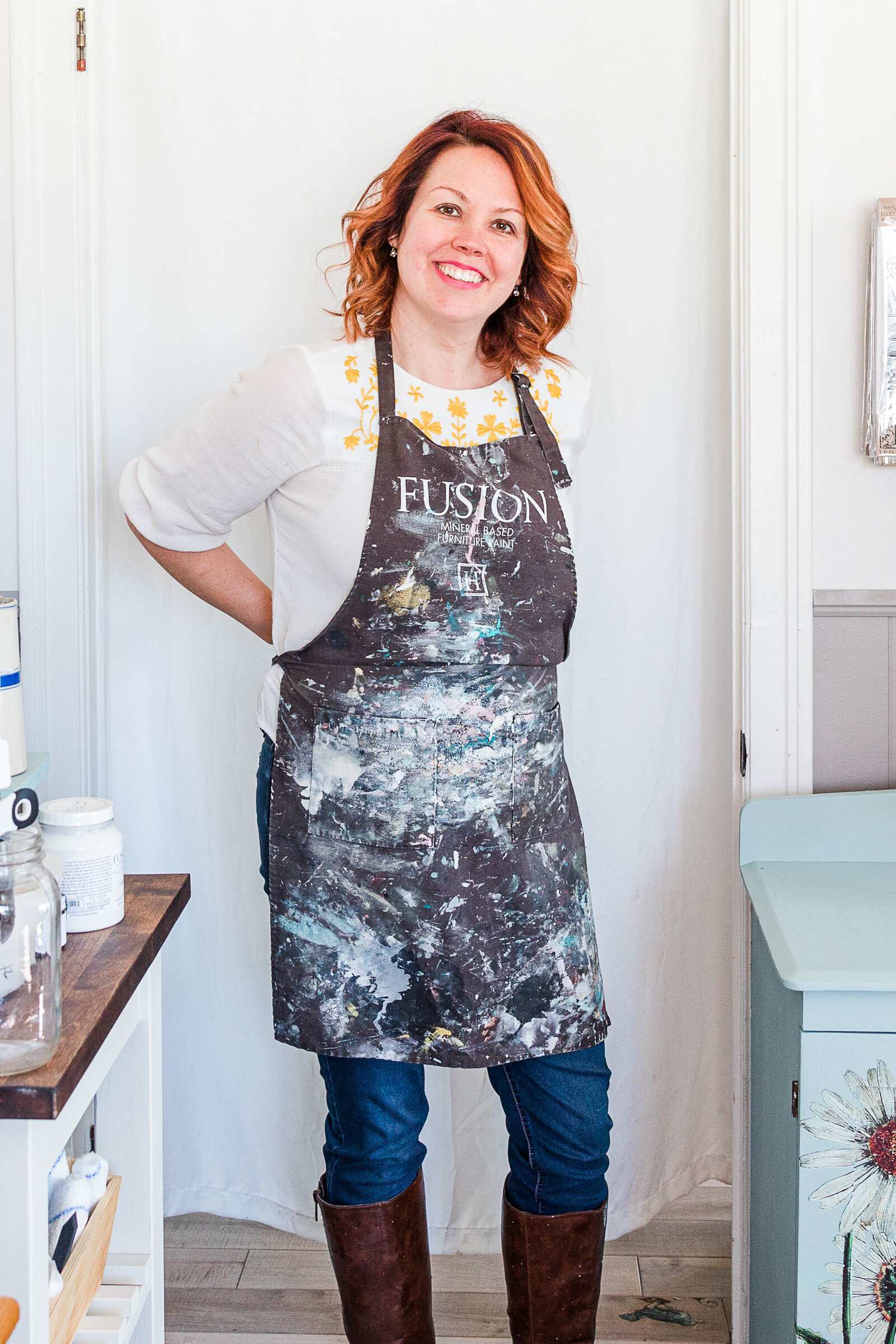 Uptique Boutique owner Janet Gilmour Tying Apron for Painting Furniture Fusion Paints Uptique Boutique Orillia Ontario Brand Photography by Linda Carnell Brand and Bloom
