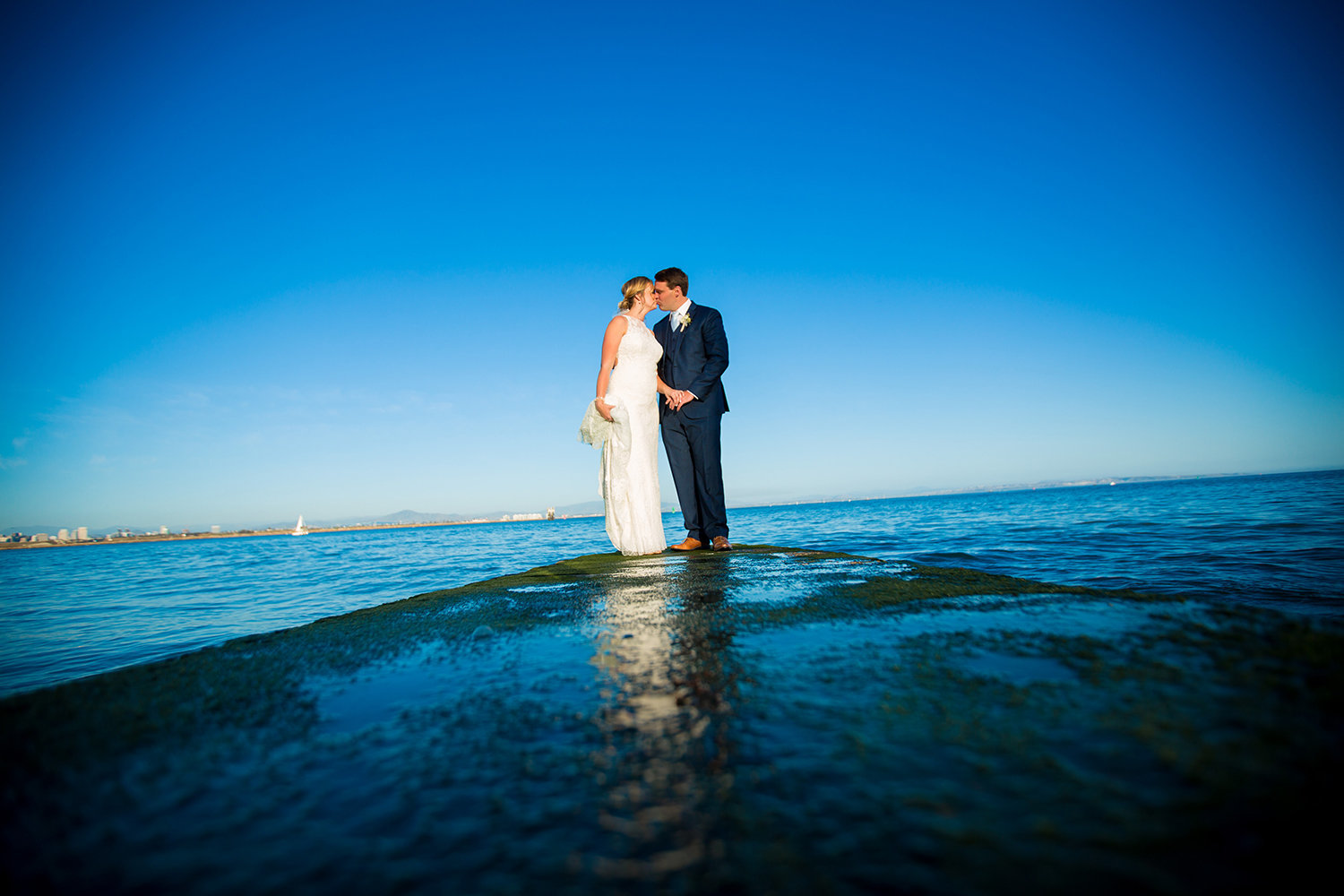 couple with ocean in back ground at ocean view room