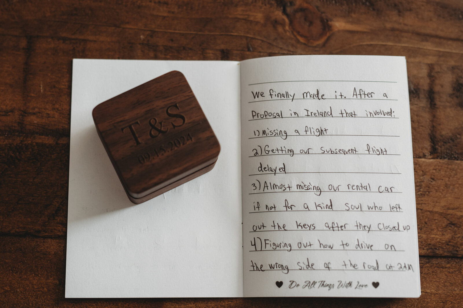 A beautifully crafted wooden wedding ring box engraved with initials, paired with heartfelt handwritten vows. This intimate wedding detail captures the love story and journey leading up to the big day. Perfect inspiration for couples looking to add a personal touch to their wedding keepsakes.