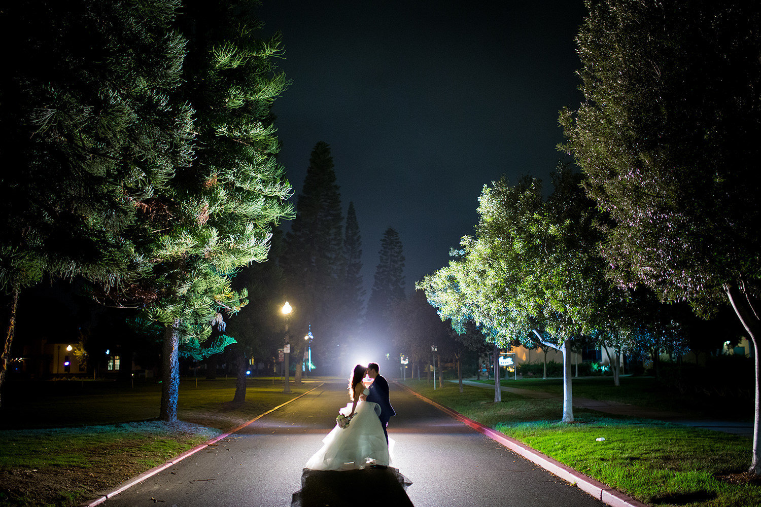 stunning night image with bride and groom at brick