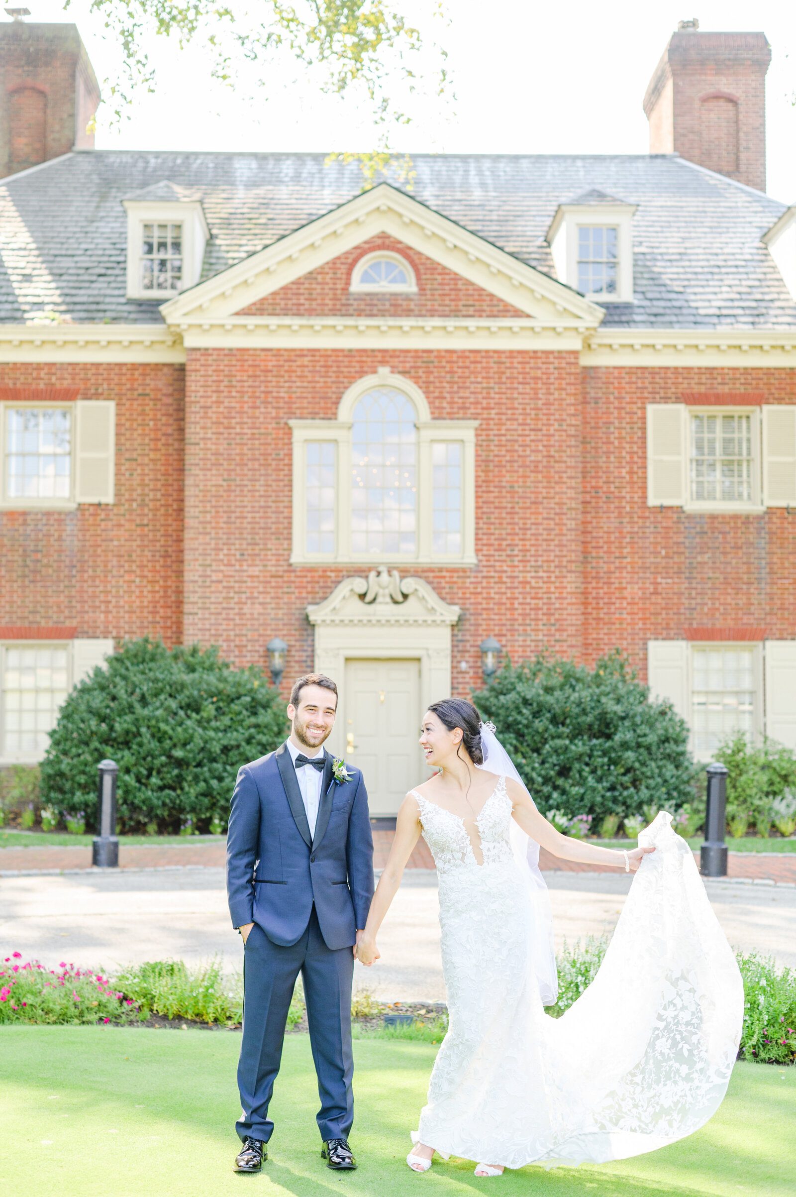 Couple Smiles in front of Wilmington Weddiles