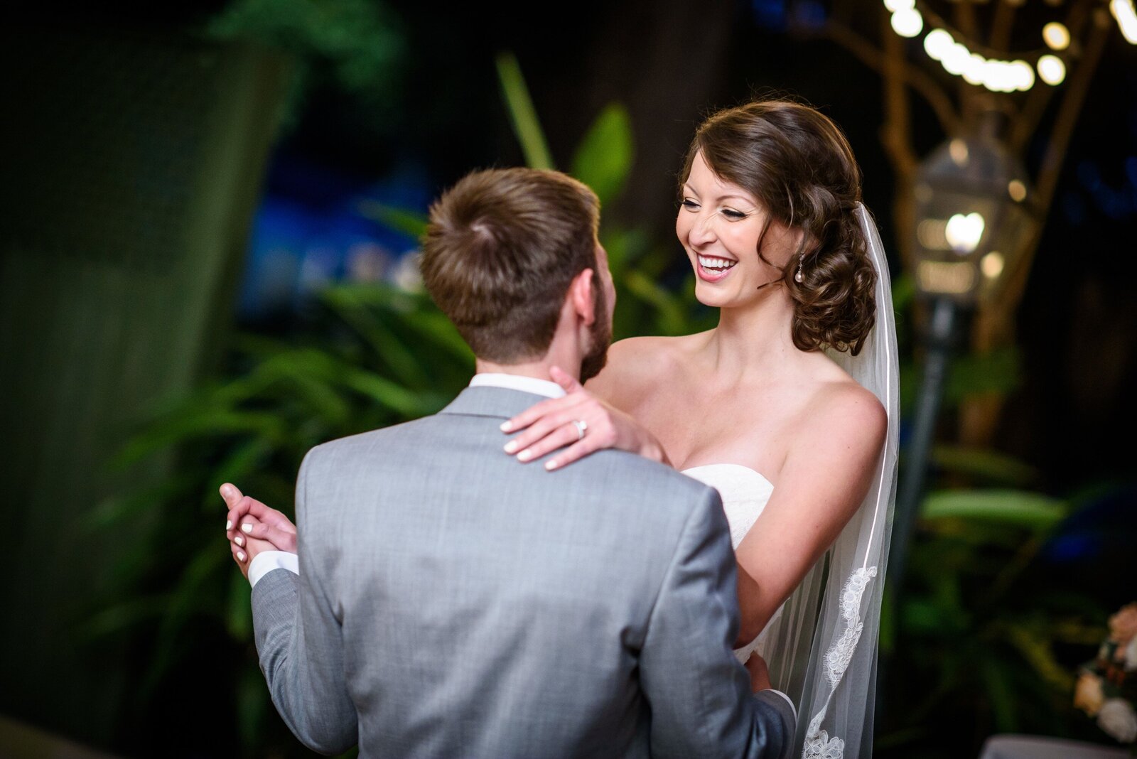 Bride and groom dance at Degas House wedding outside