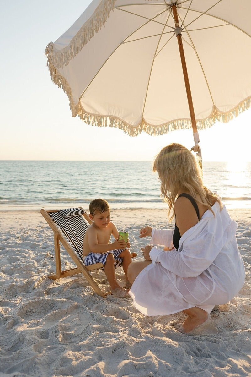 mom and son playing on Naples Florida beach