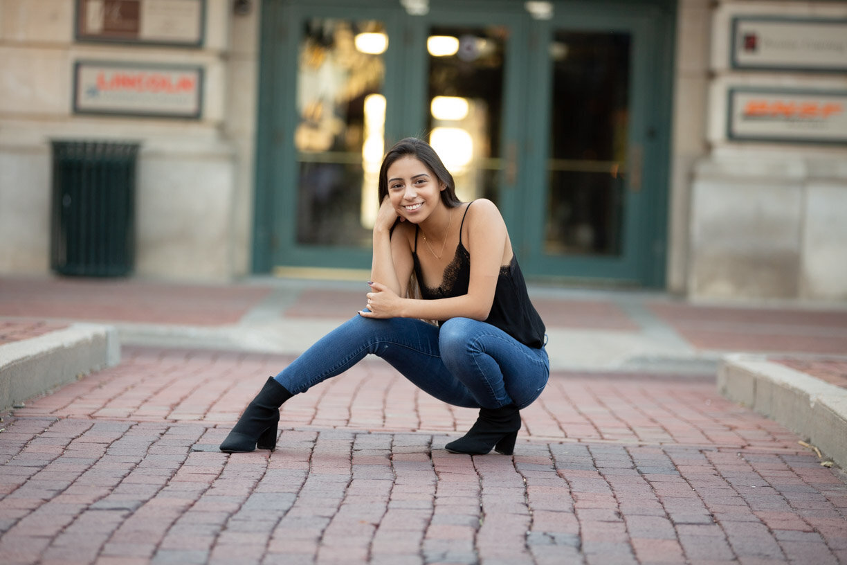 Gabrielle strikes a pose in the Haymarket during a  senior photo session