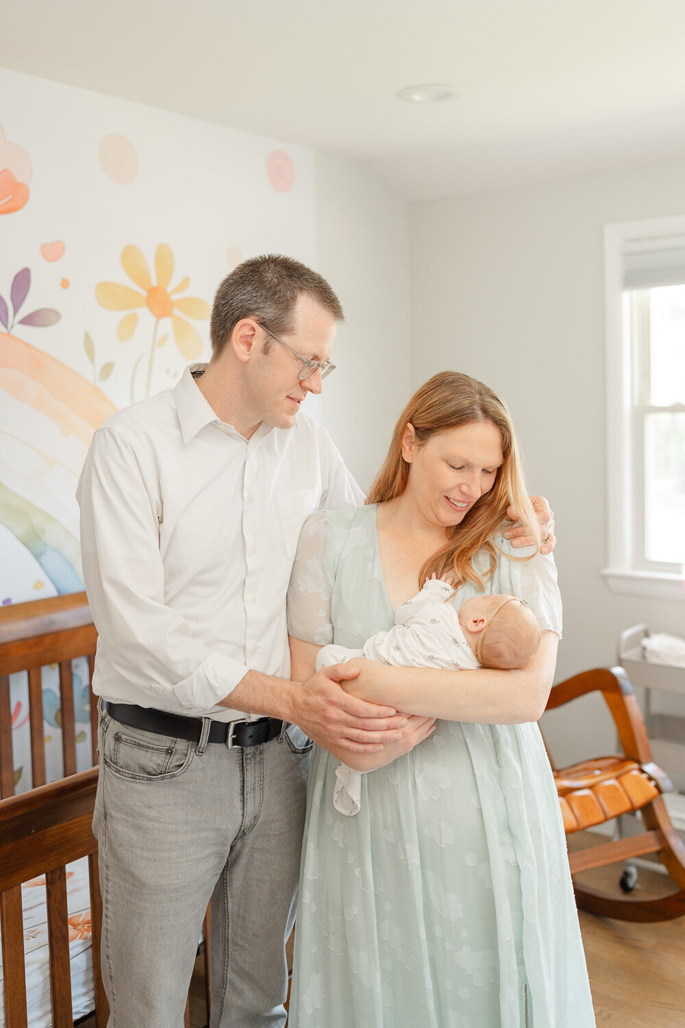 parents stand with baby in the nursery during McLean, Virginia newborn picture