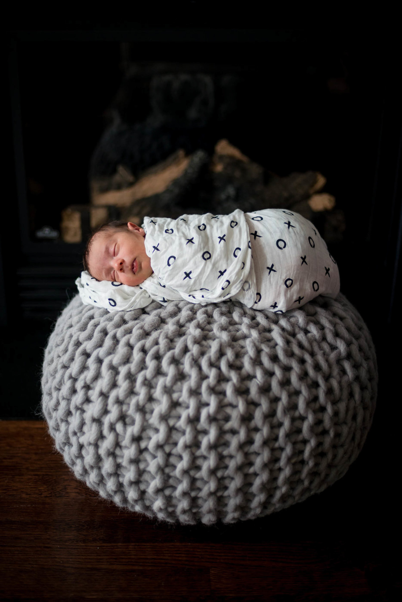 Newborn posed at home lifestyle session Boston in chair