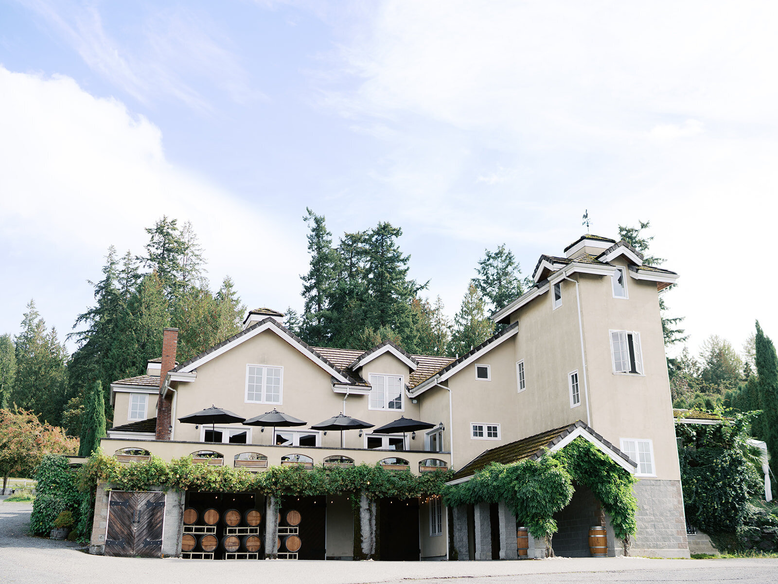 Front view of the venue with rustic charm and lush greenery