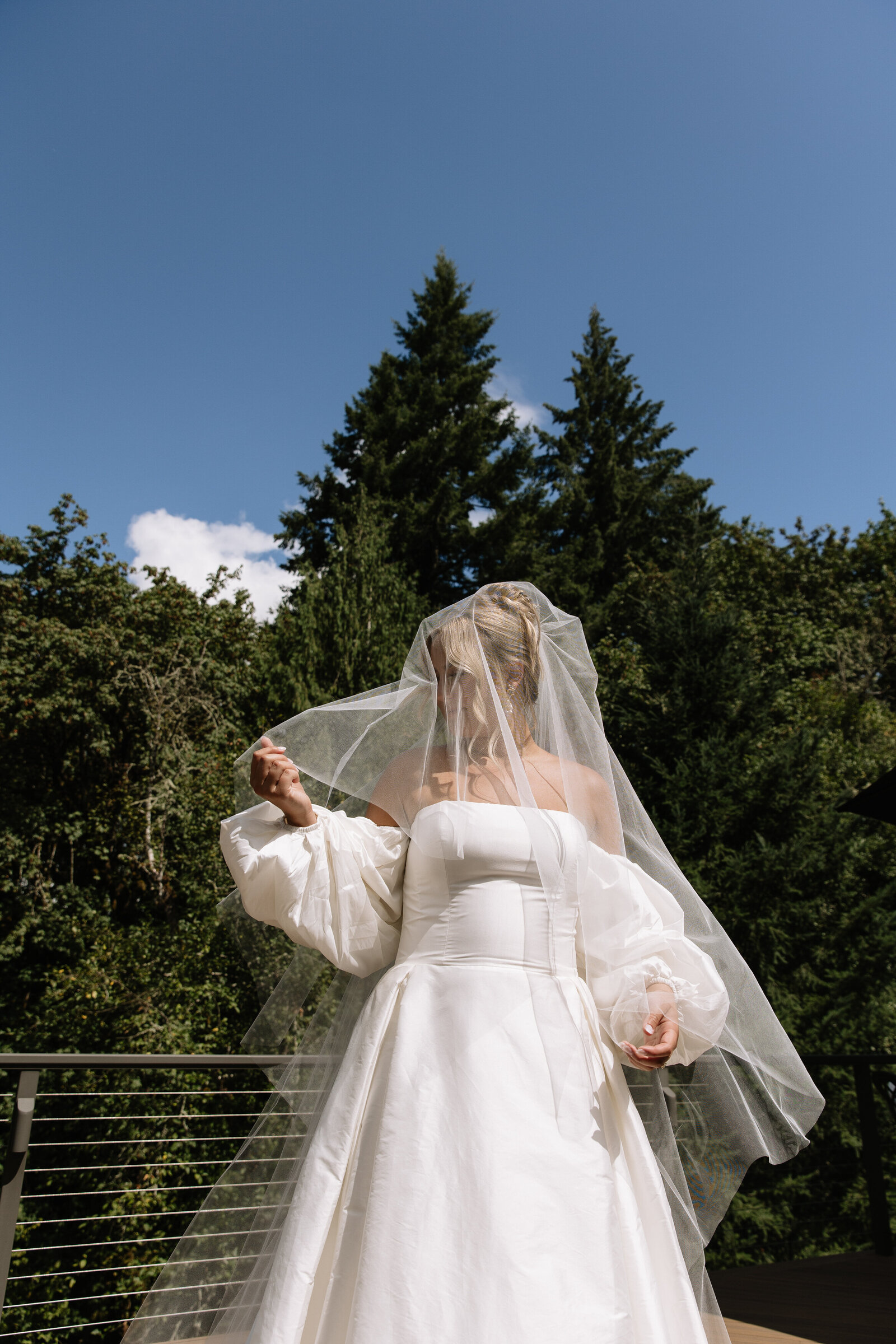 Bride with veil draping over face taken by Washington elopement photographers