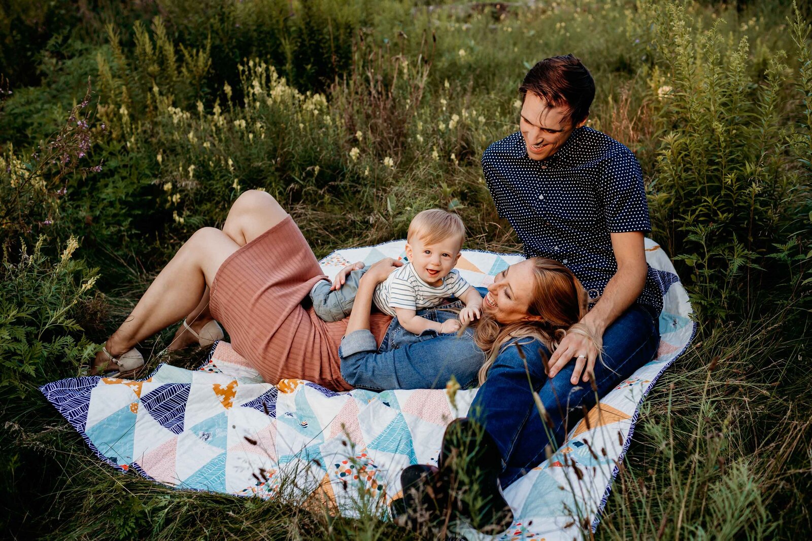 parents and baby portrait on quilt
