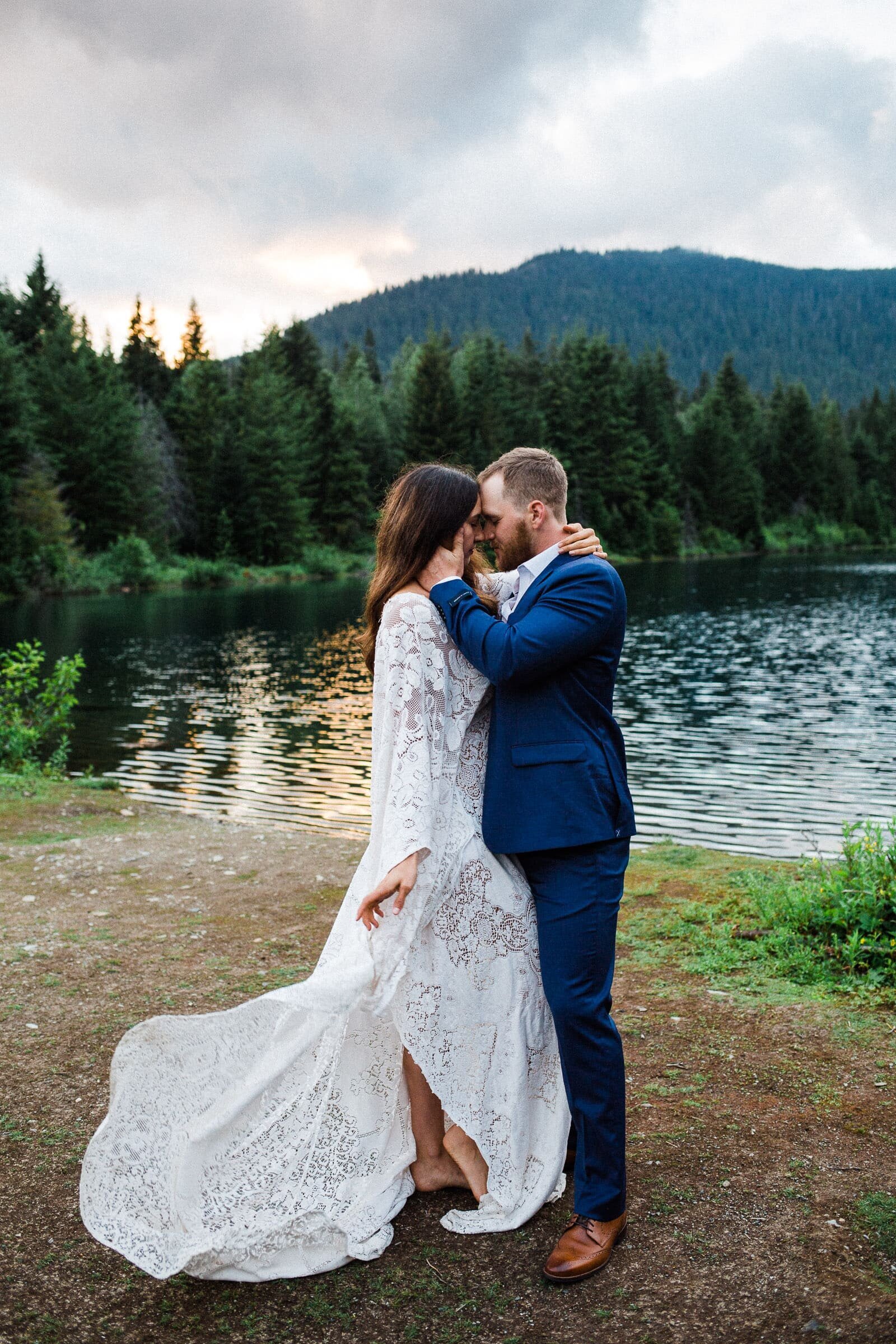 Bride and groom touching foreheads at elopement session