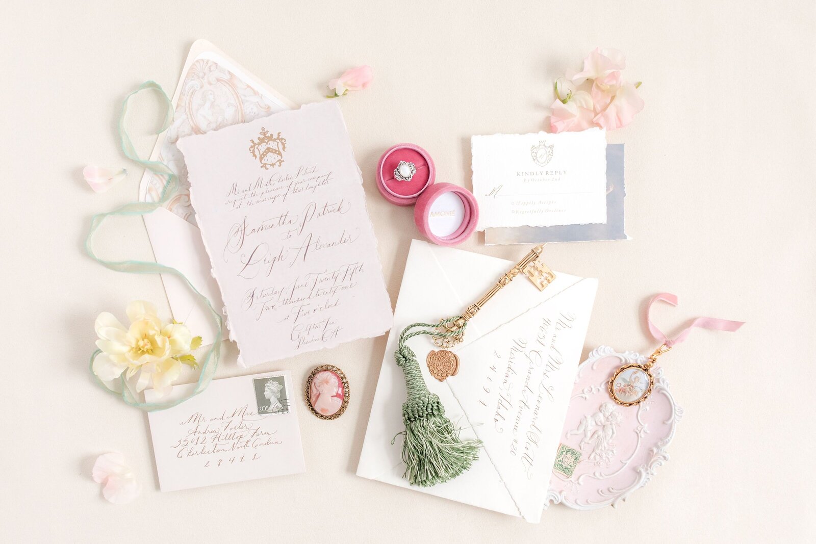 elegant invitation styled neatly with engagement ring and antique accessories