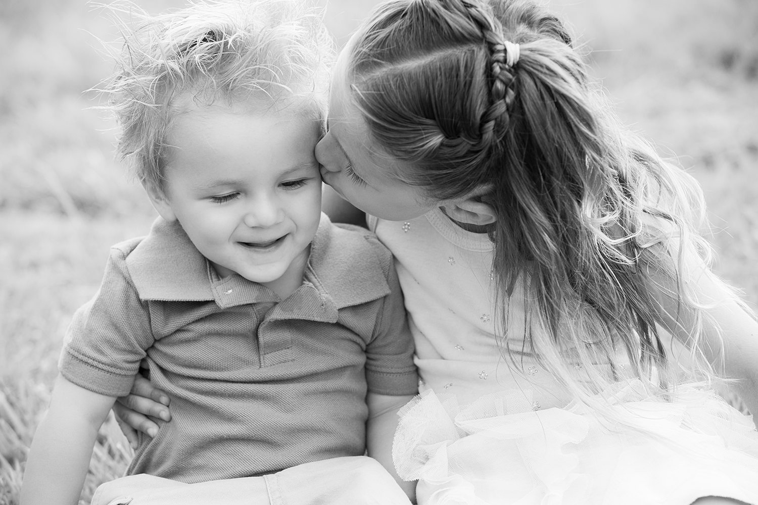 san diego family photographer | sister kissing brother on the head black and white