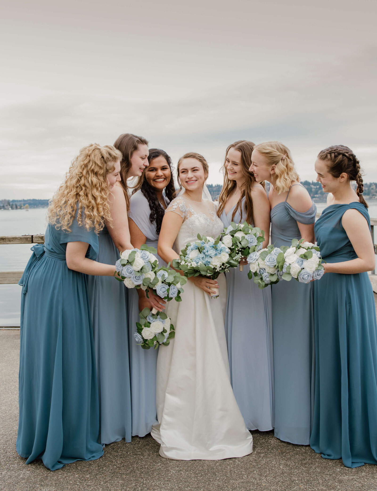 Bride and her bridesmaids huddled together