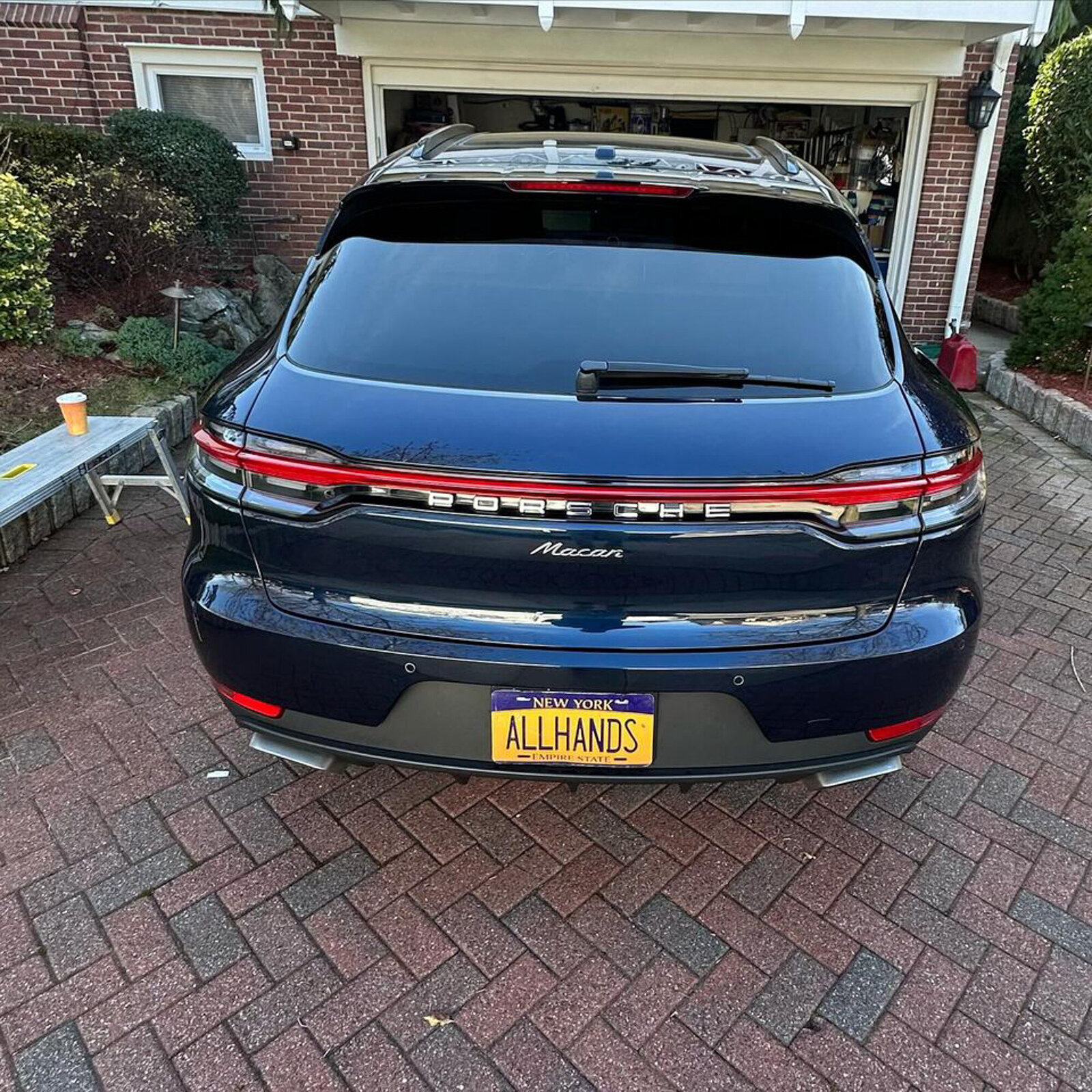 Rear view of a detailed Porsche Macan with a custom license plate
