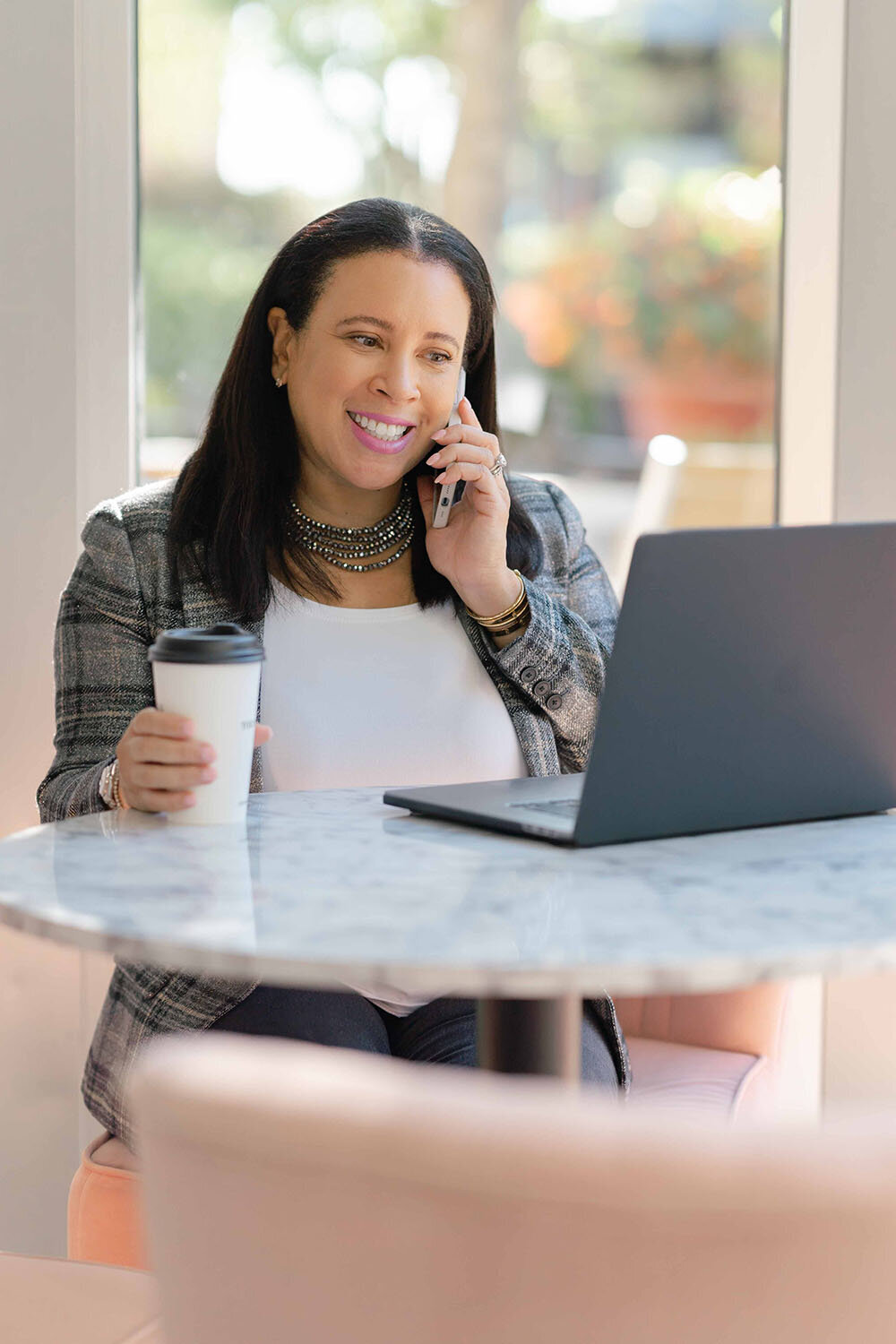 events planner talking to someone on the phone during branding photography in Gainesville,VA