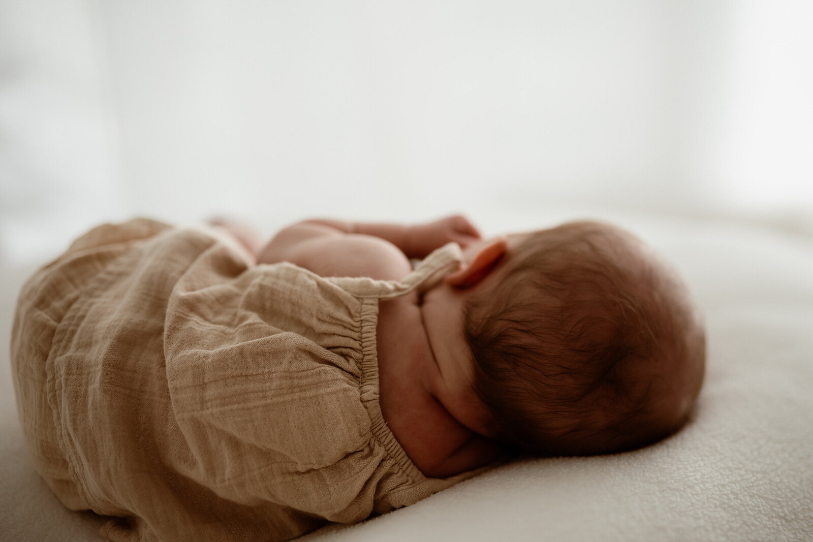 back of baby's head, super cute little neck rolls, from baby photoshoot