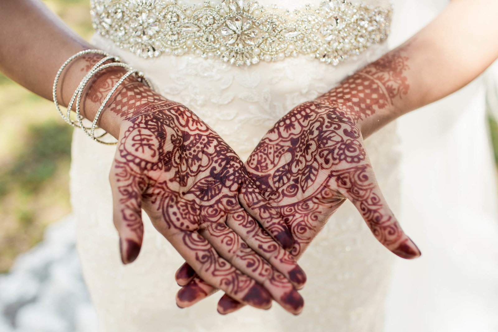 Bride shows her hands designed with henna, White Point Garden, South Carolina