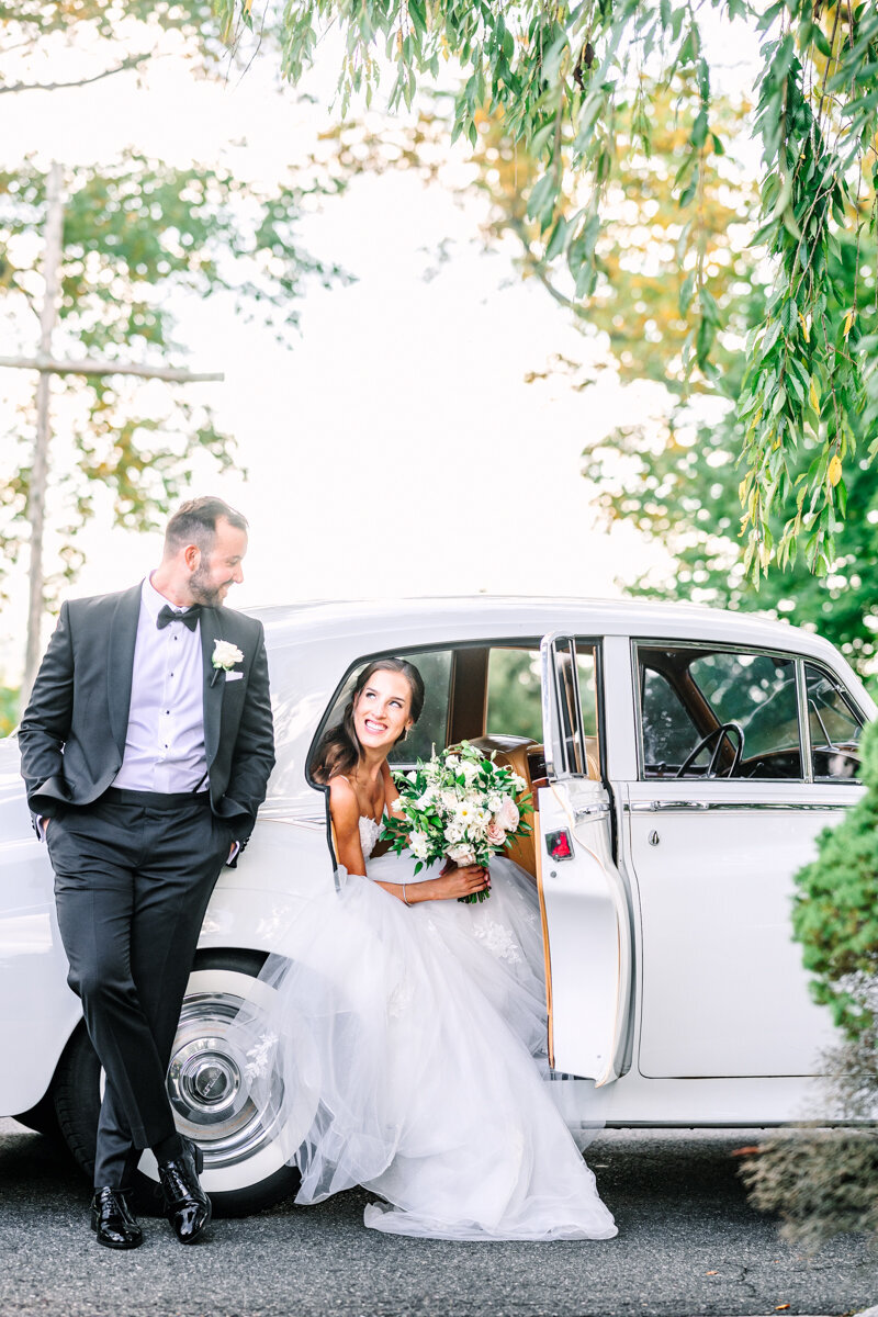 bride and groom in stylish car