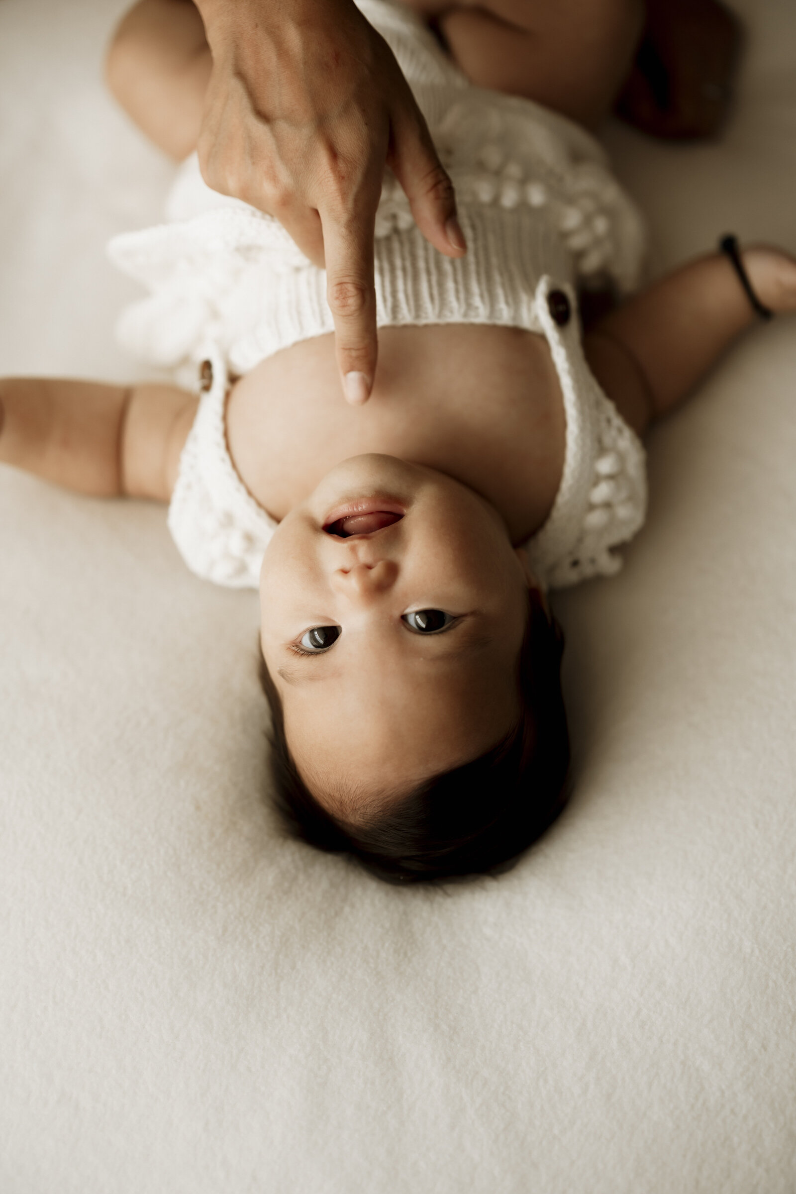 Candid newborn family photography in a Perth studio – relaxed, emotional, and full of love.